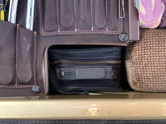 Westy Smuggler leather storage pouch fitted beneath the rear wardrobe cabinet of a Vanagon Westfalia