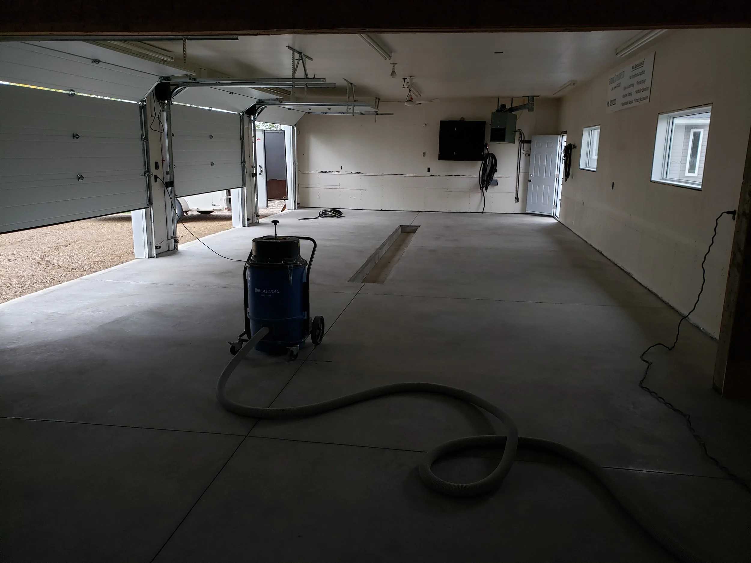 Unfinished garage floor. 