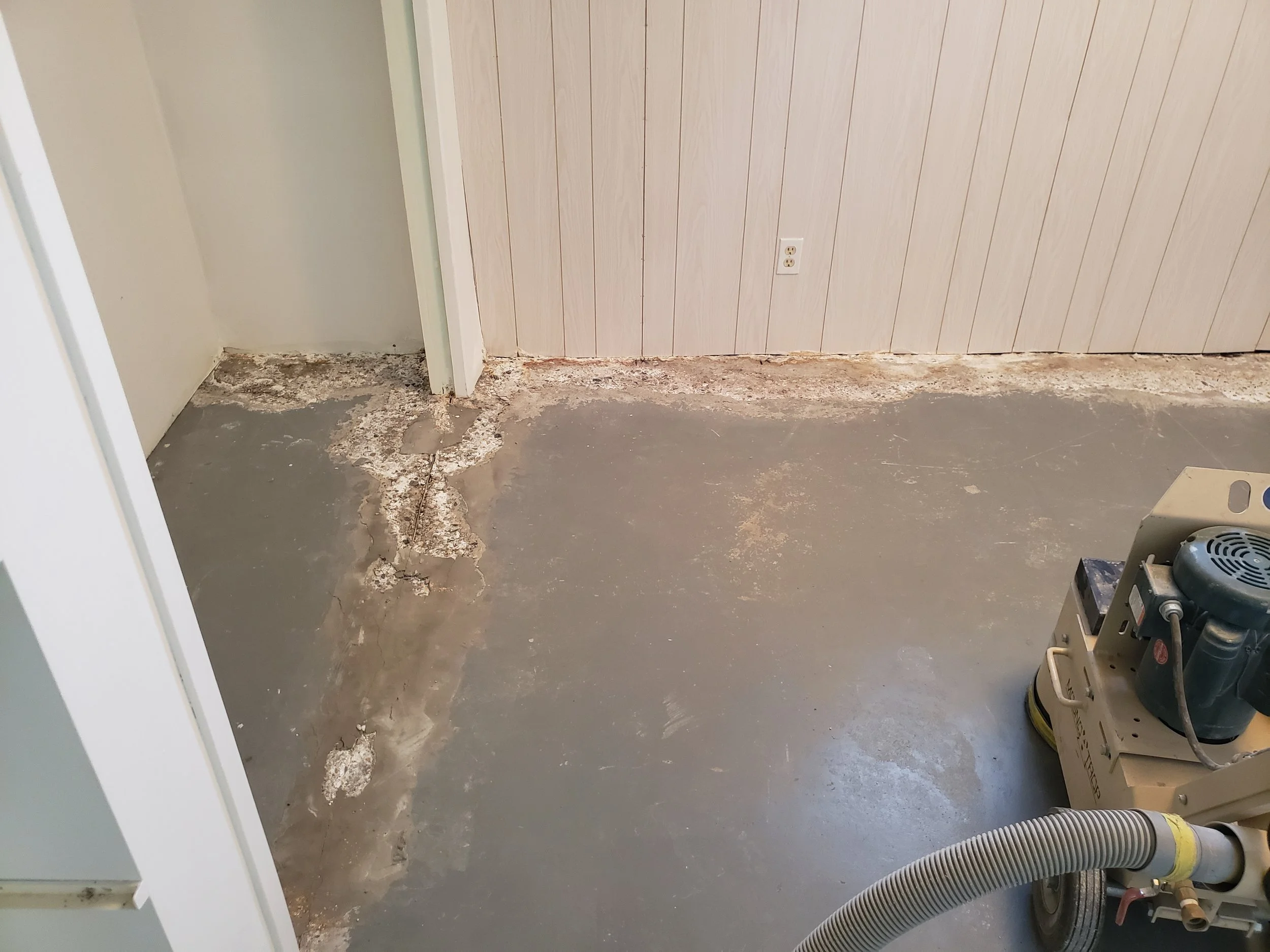 	
Basement floor unfinished getting grinded prepared for coating.