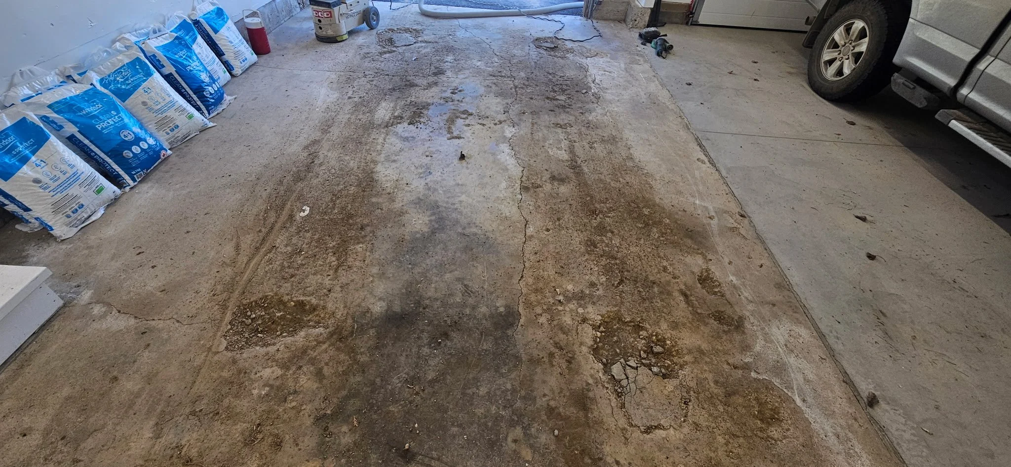 BEFORE - Damaged, pitting concrete from salt exposure. 