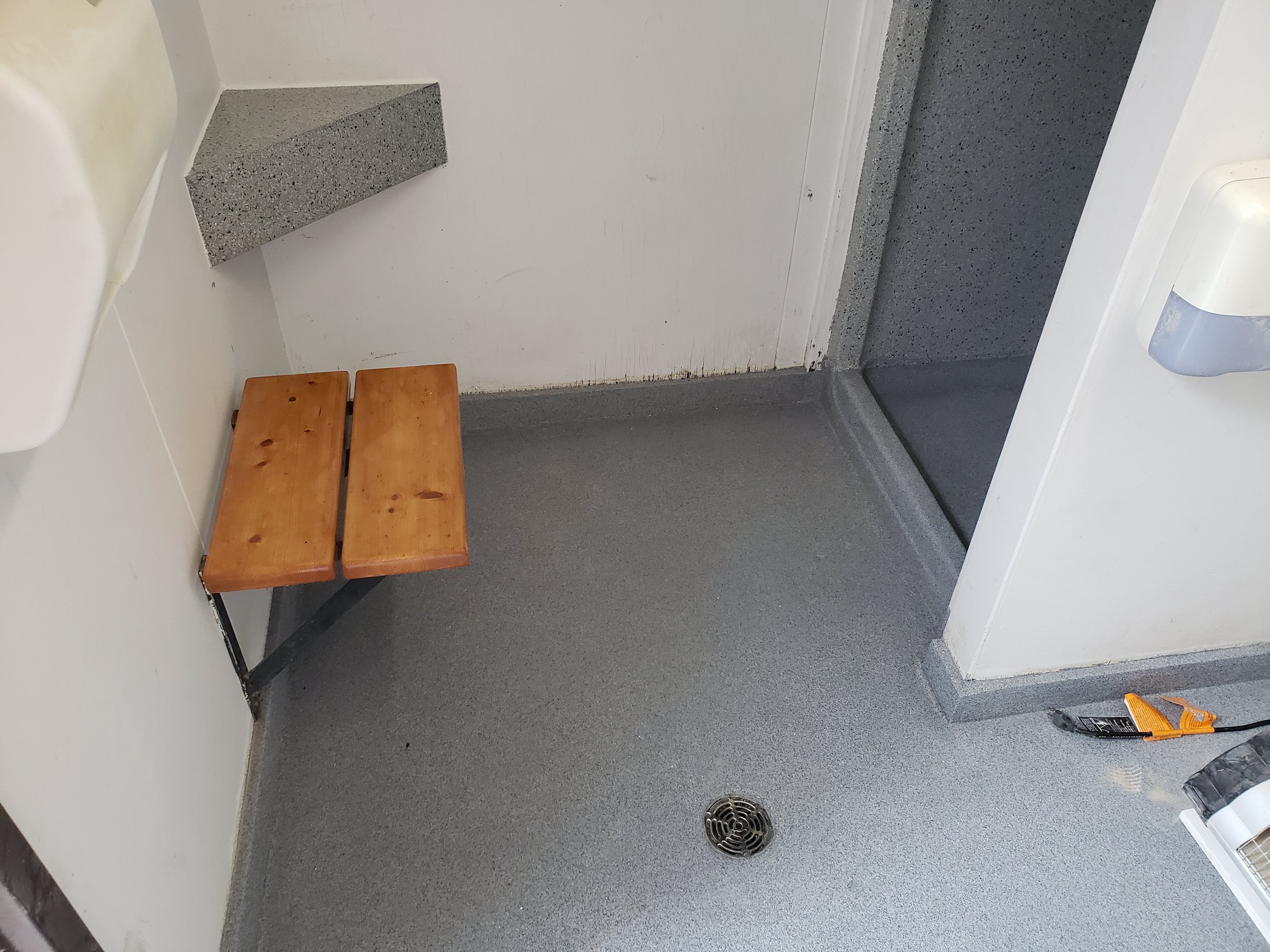 Provincial Park bathroom floor coated in polyaspartic quartz stone. 