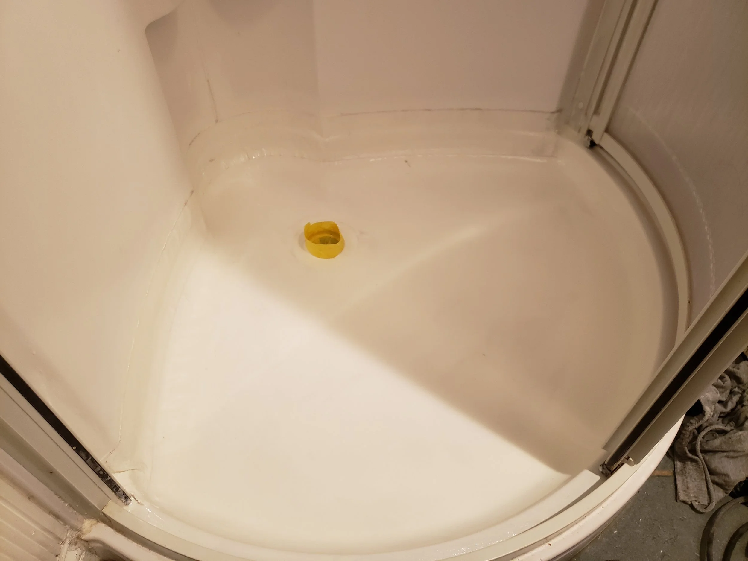 Shower floor before, slippery and unattractive. 