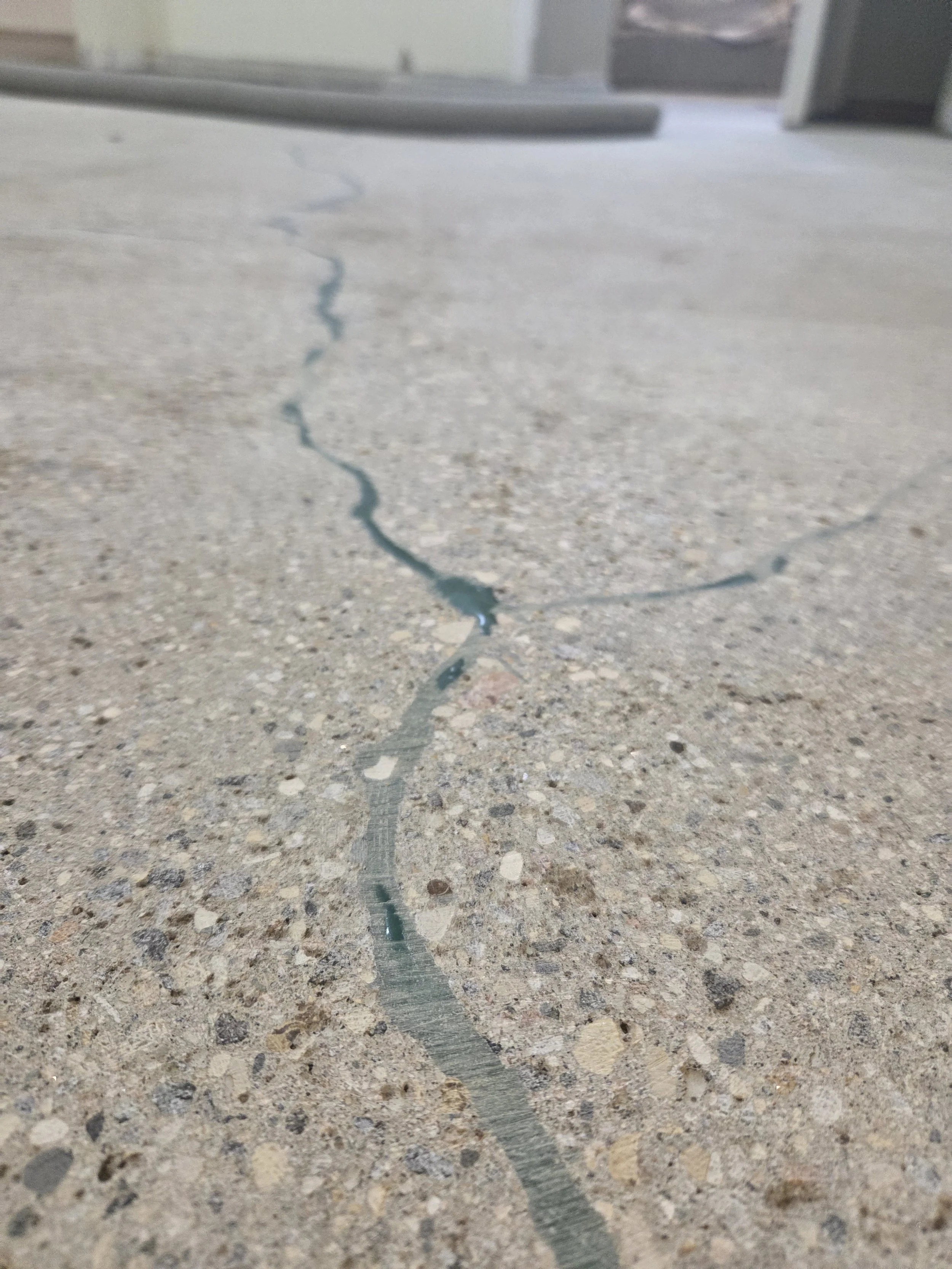 PROCESS - Cracks filled and grinded.