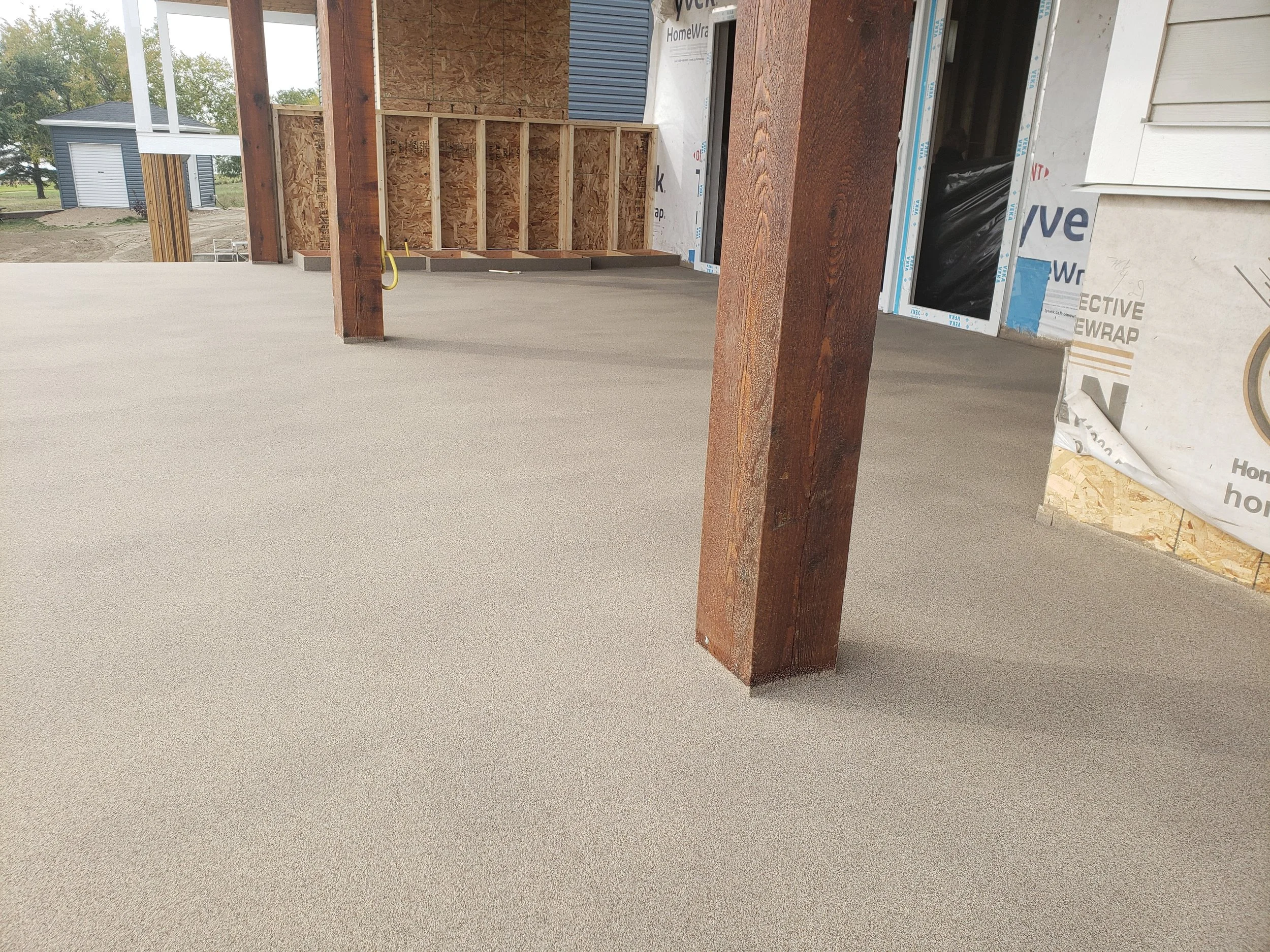 Quartz Stone polyaspartic coated back patio area.