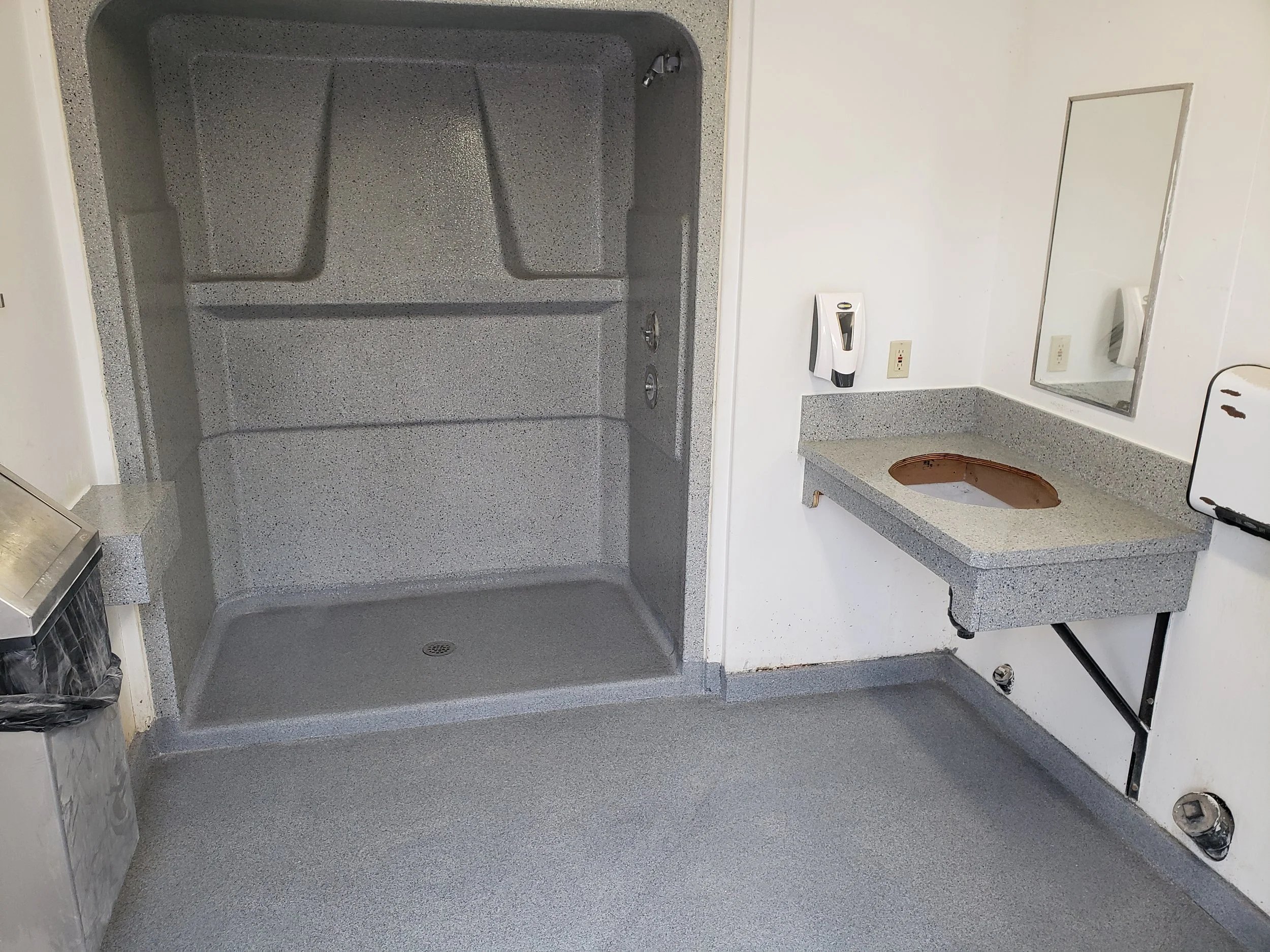 	
Shower, floor and countertop coated in polyaspartic full flake broadcast.