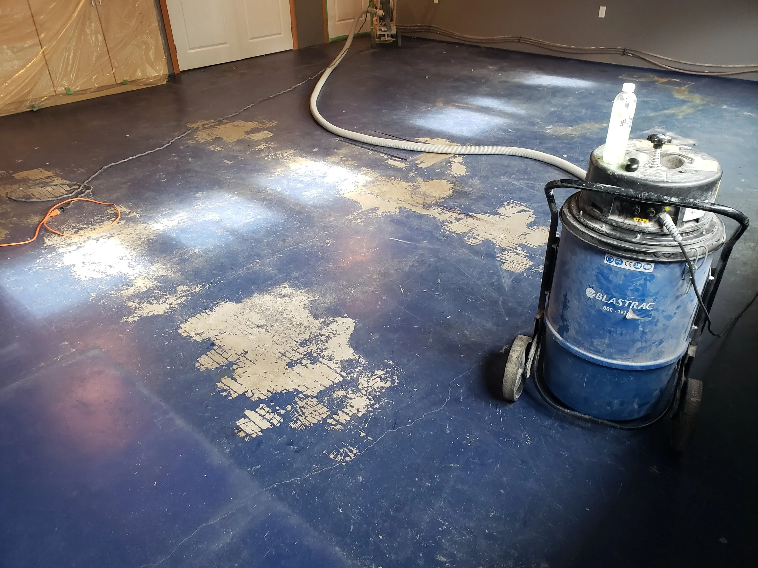 BEFORE - Painted concrete, chipping and peeling.