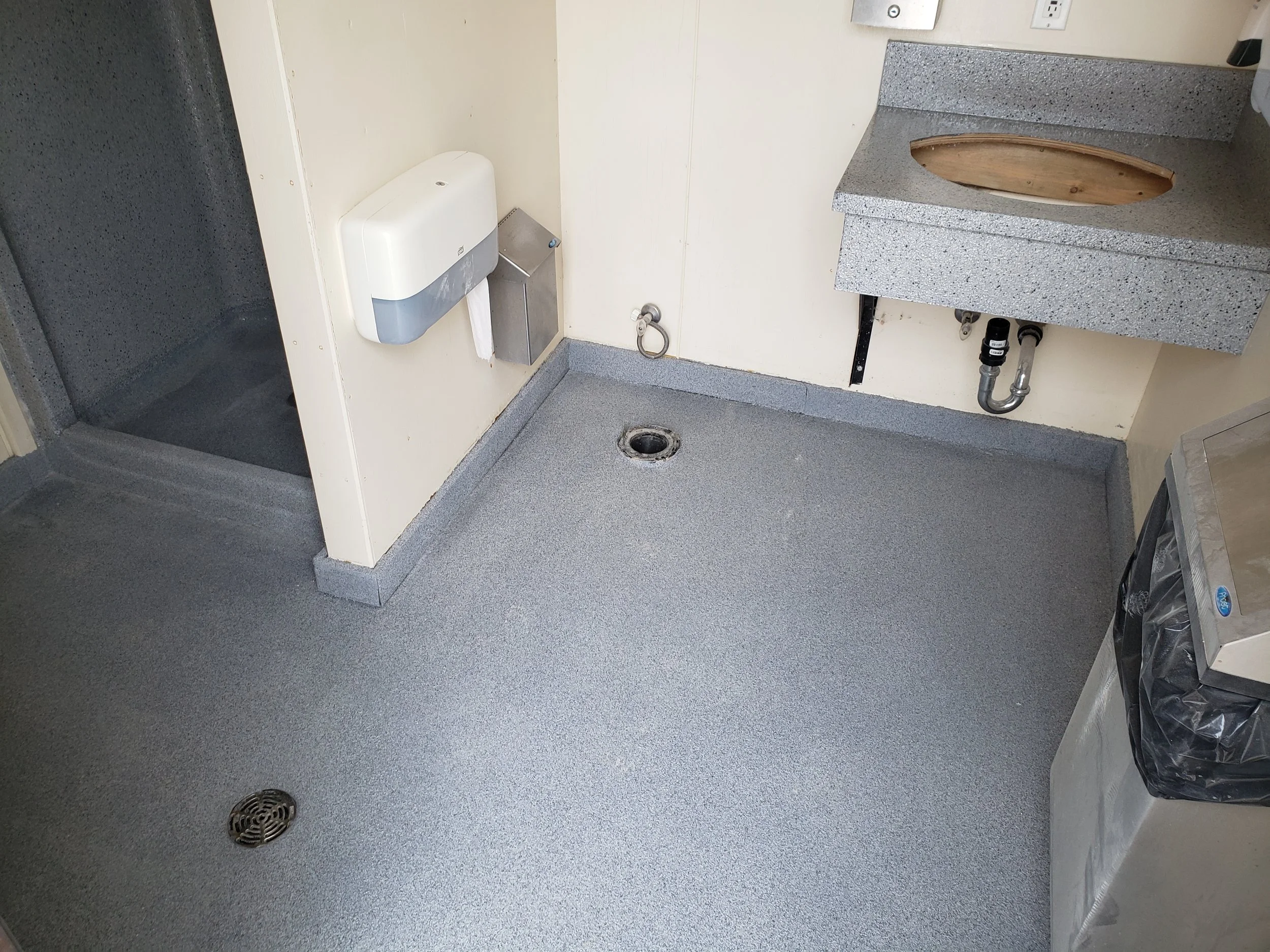 Provincial Park bathroom floor coated in polyaspartic quartz stone. 