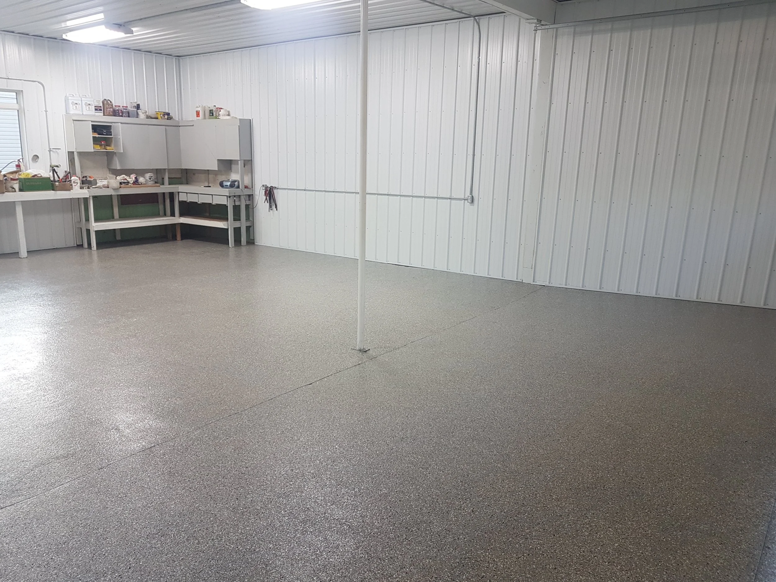 Full flake broadcast polyaspartic coated garage floor. 