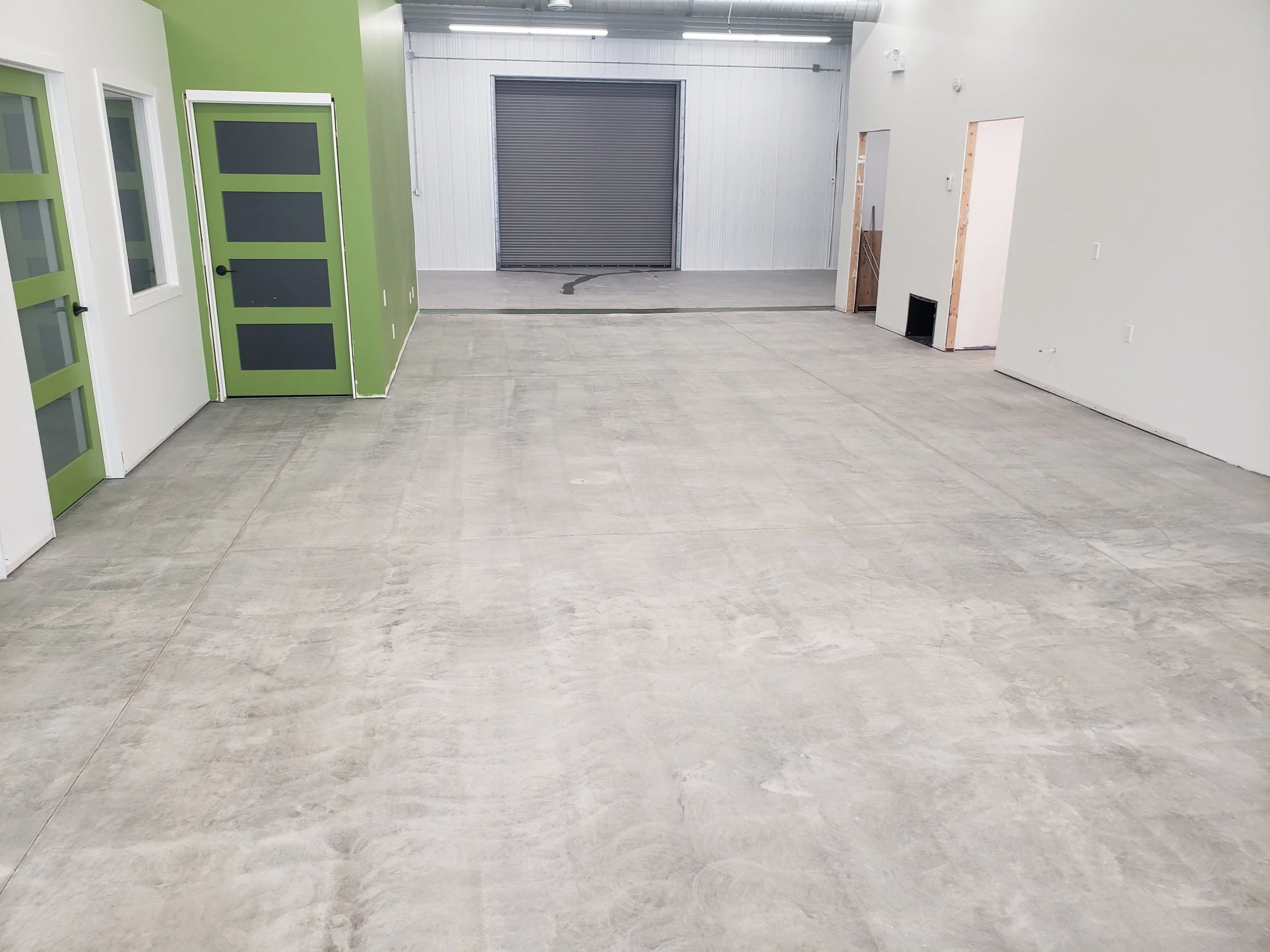 BEFORE - Bare concrete grinded and repaired.