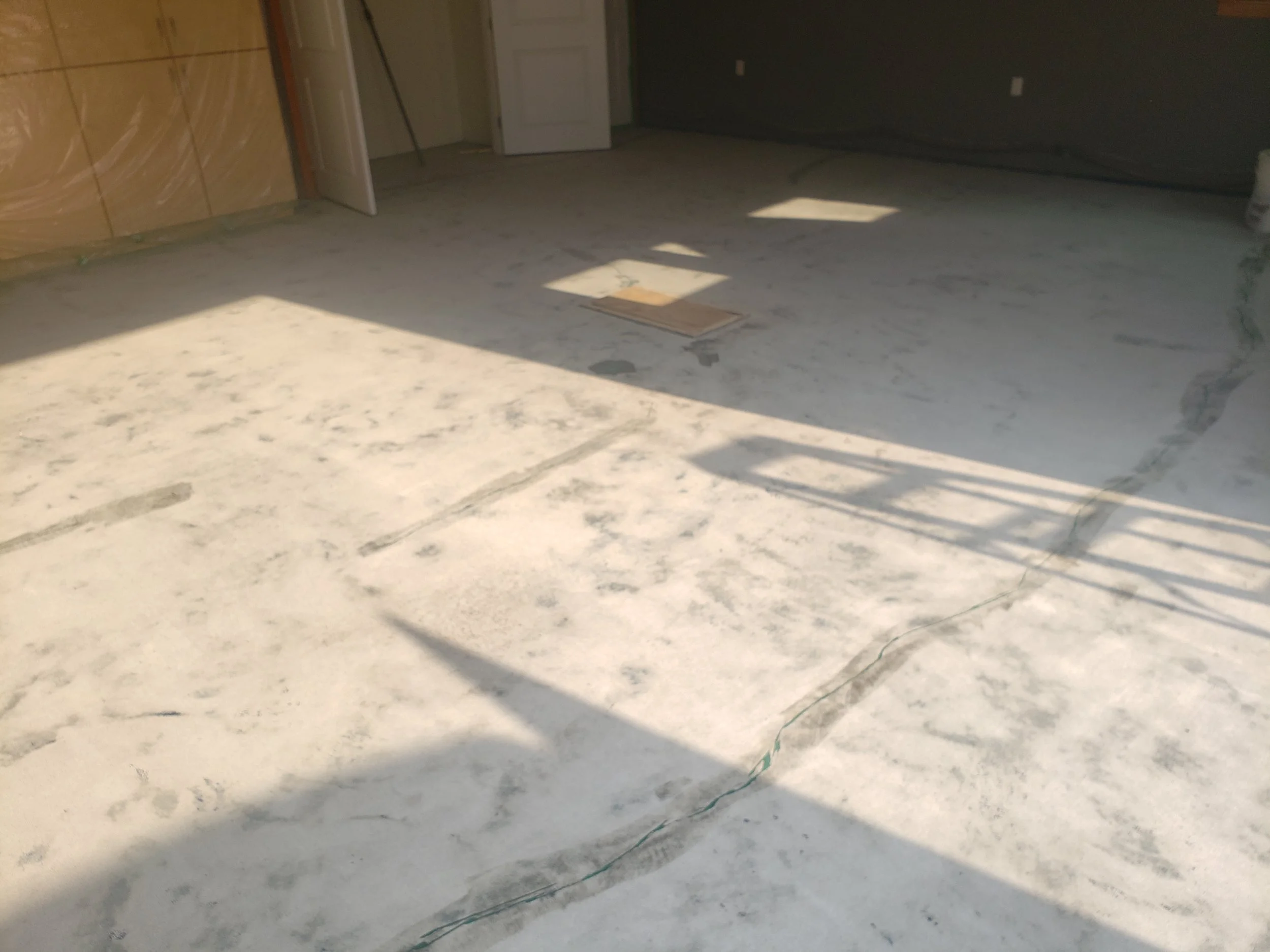 BEFORE - Concrete grinded and repaired.