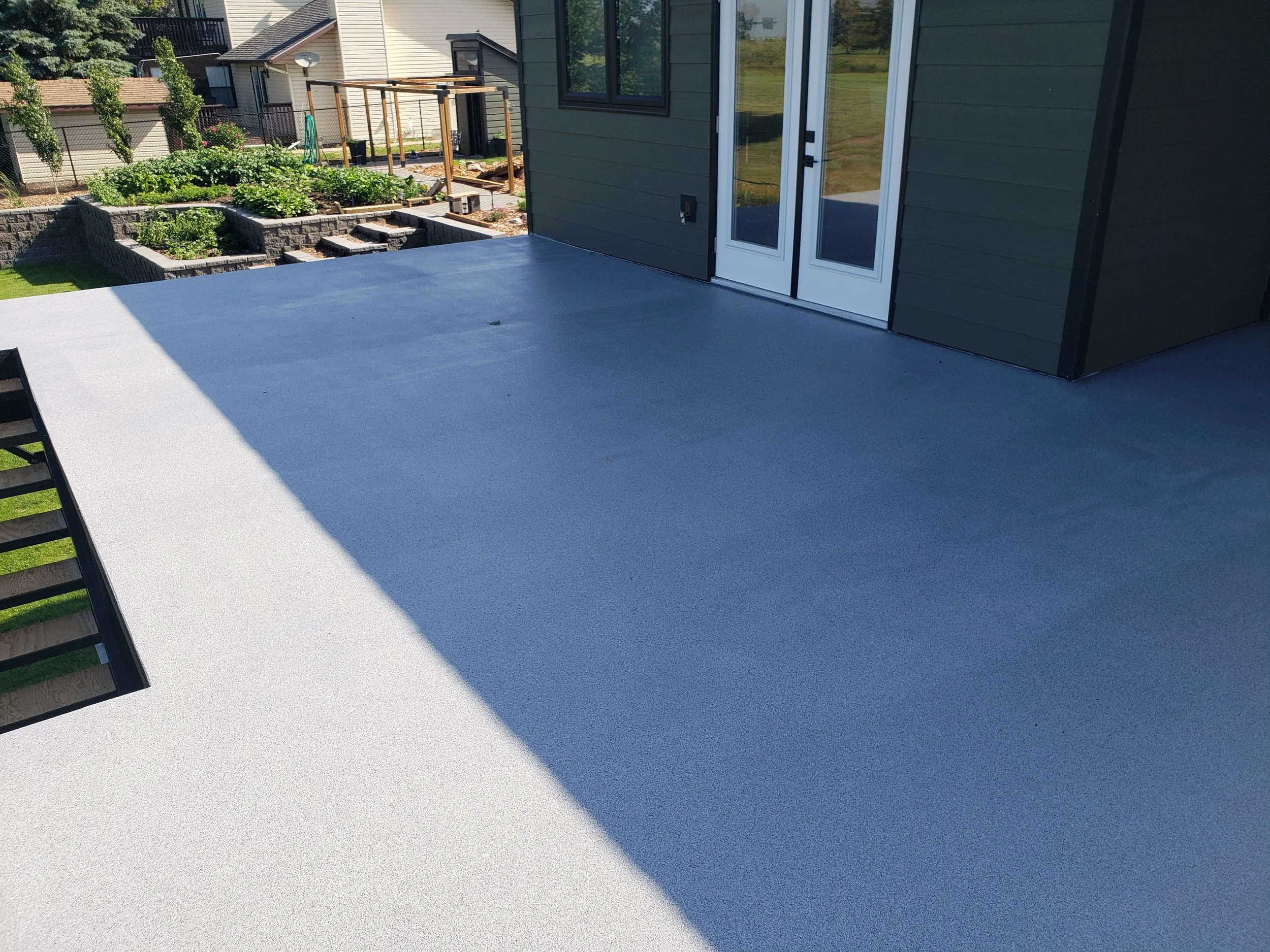 Polyaspartic quartz stone coated patio area. 