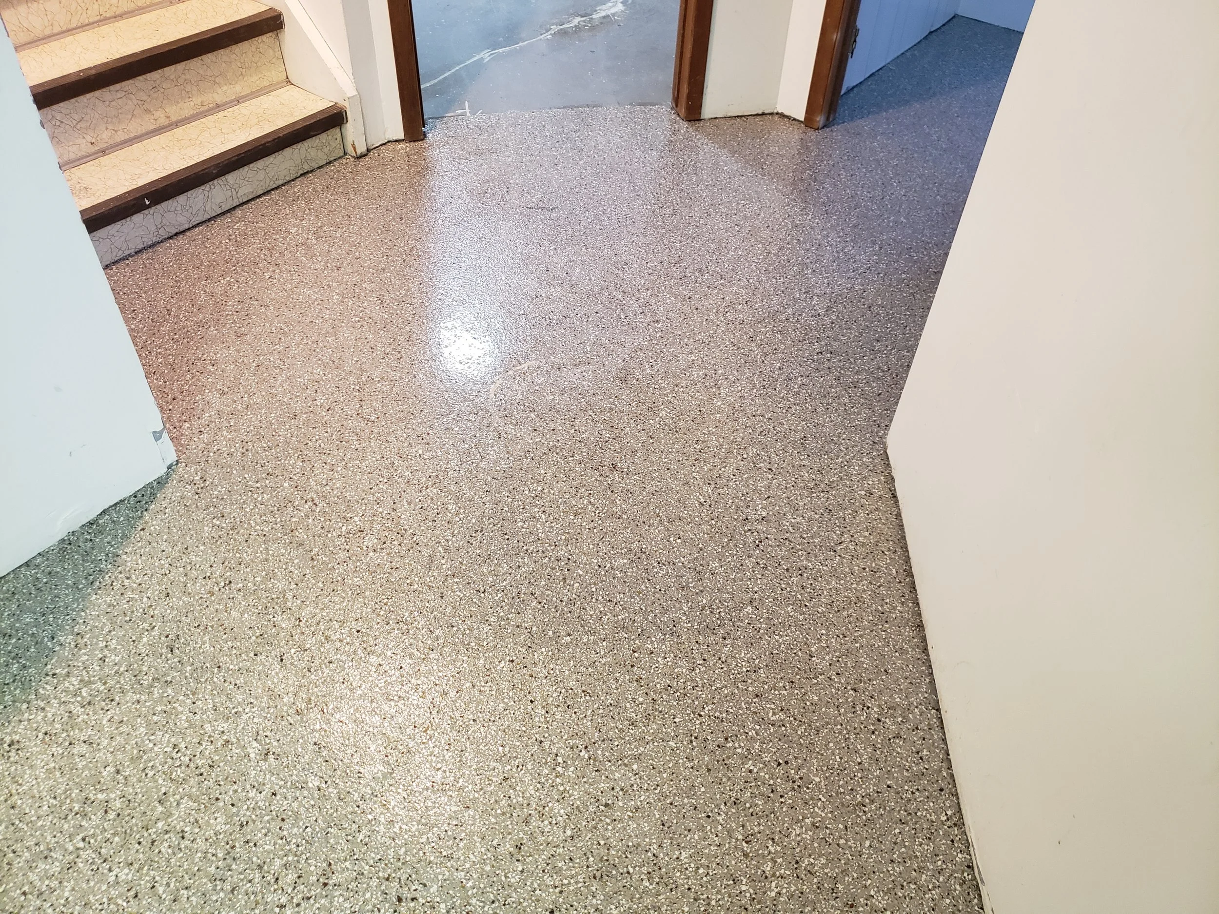 Finished basement floor. Coated in full flake broadcast polyaspartic. 