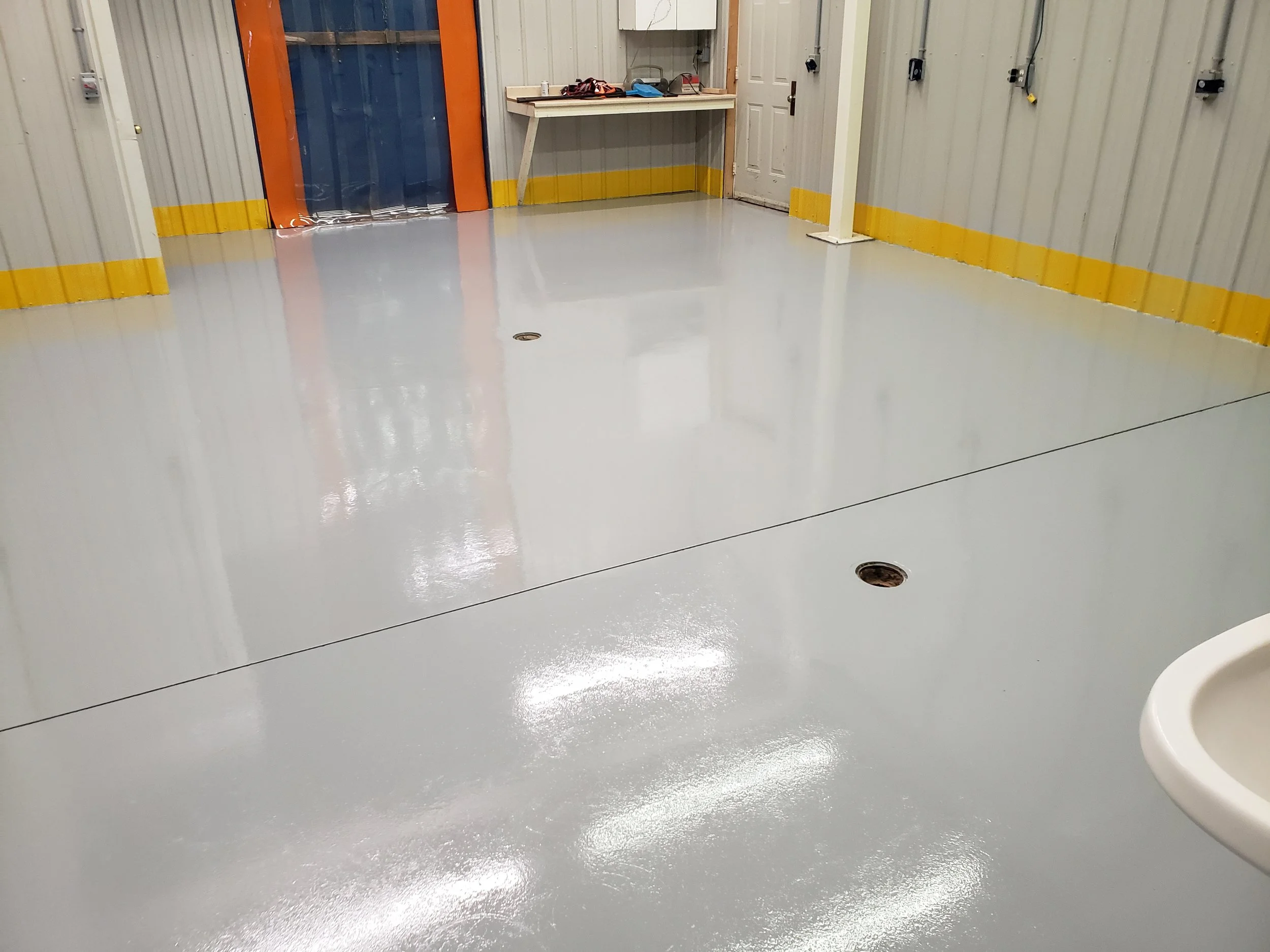 solid base grey polyaspartic industrial floor.