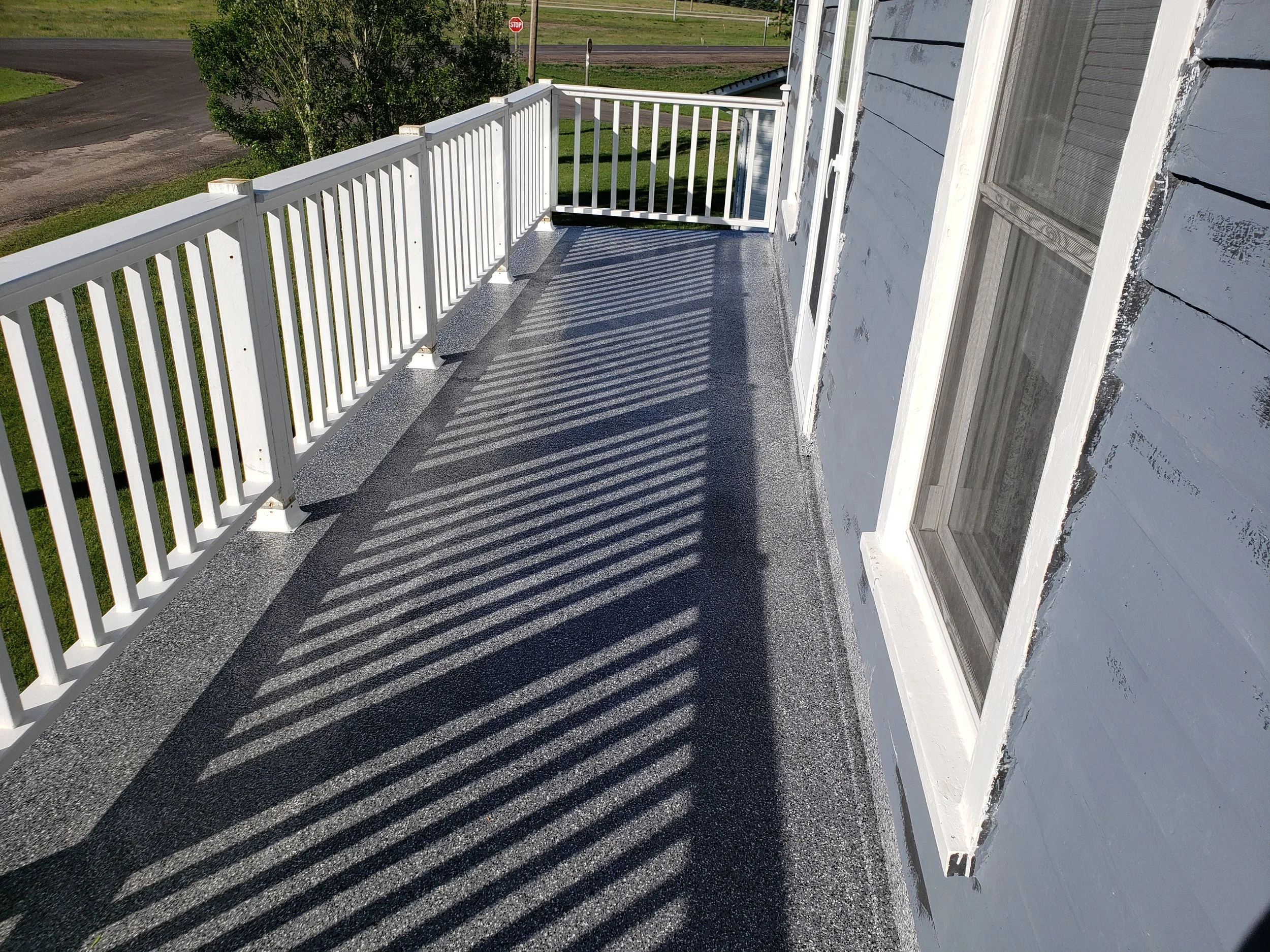 AFTER - Finished in Charcoal 1/4" Full Flake Broadcast.