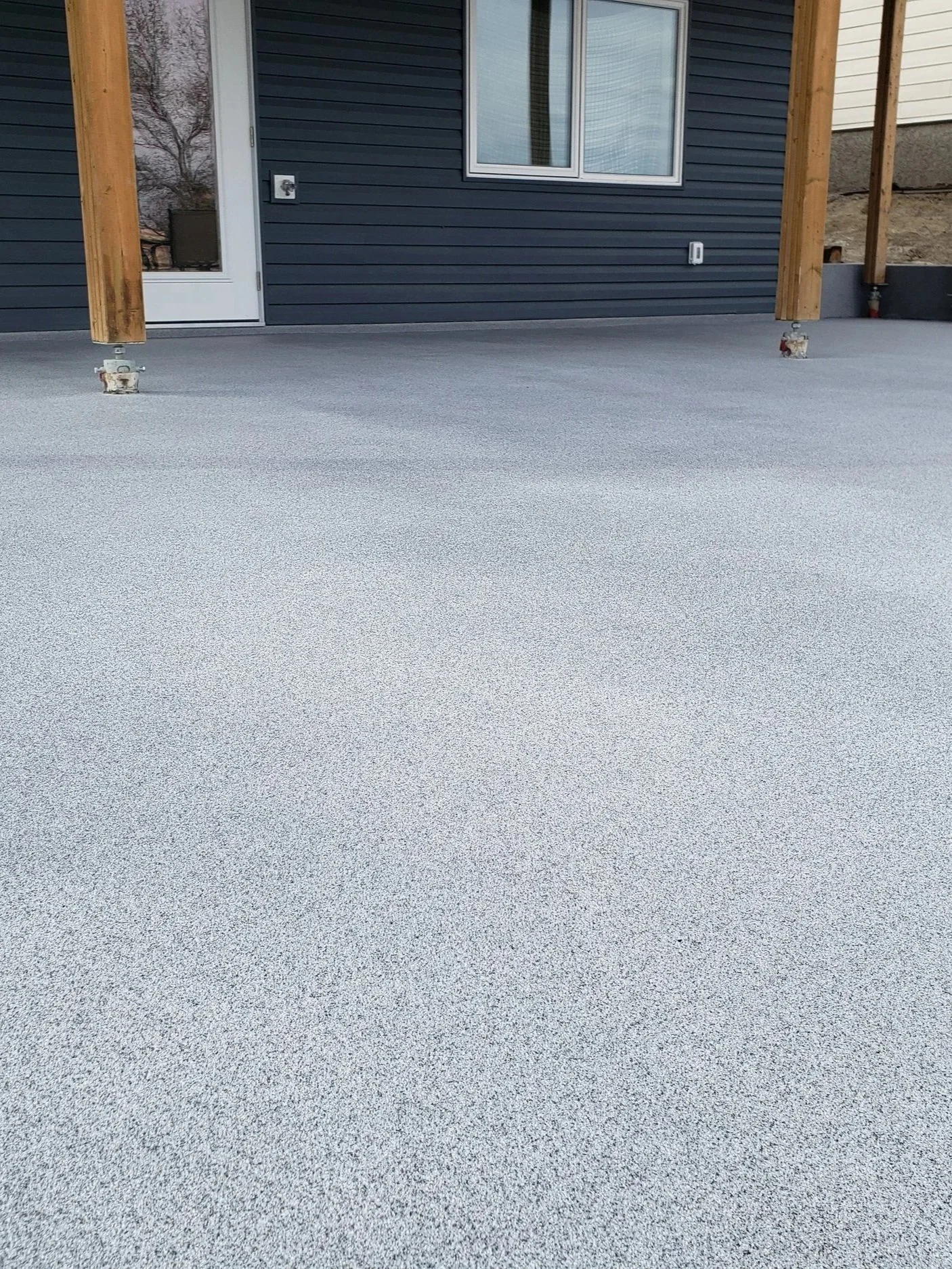 Quartz Stone polyaspartic coated back patio area.