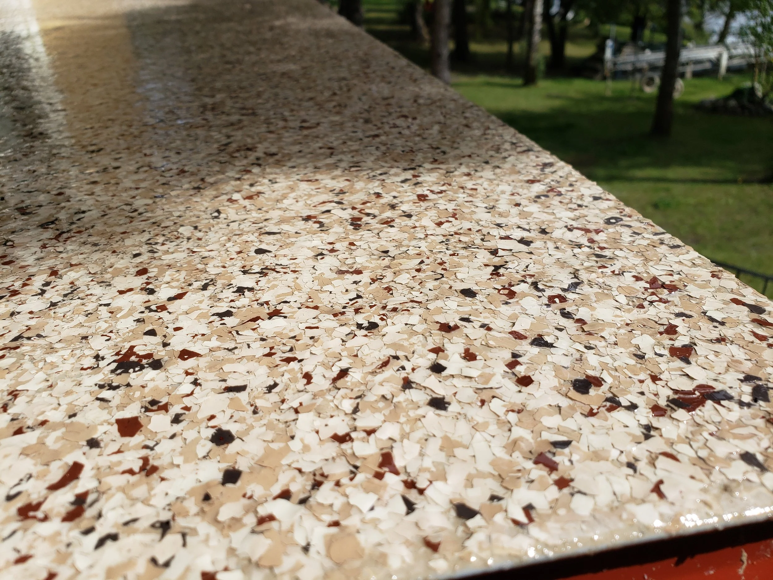 Finished in Chestnut 1/4" Full Flake Broadcast.