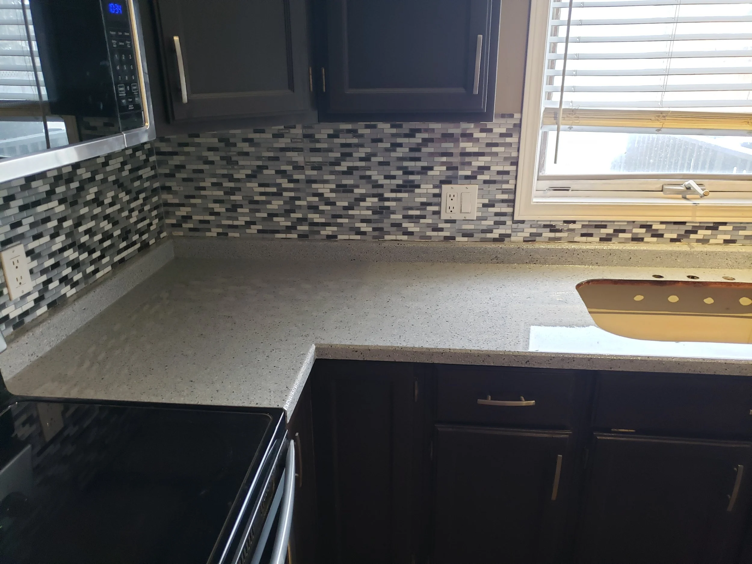 Kitchen countertop refinished in full flake polyaspartic coating. Food safe, waterproof and smooth. 