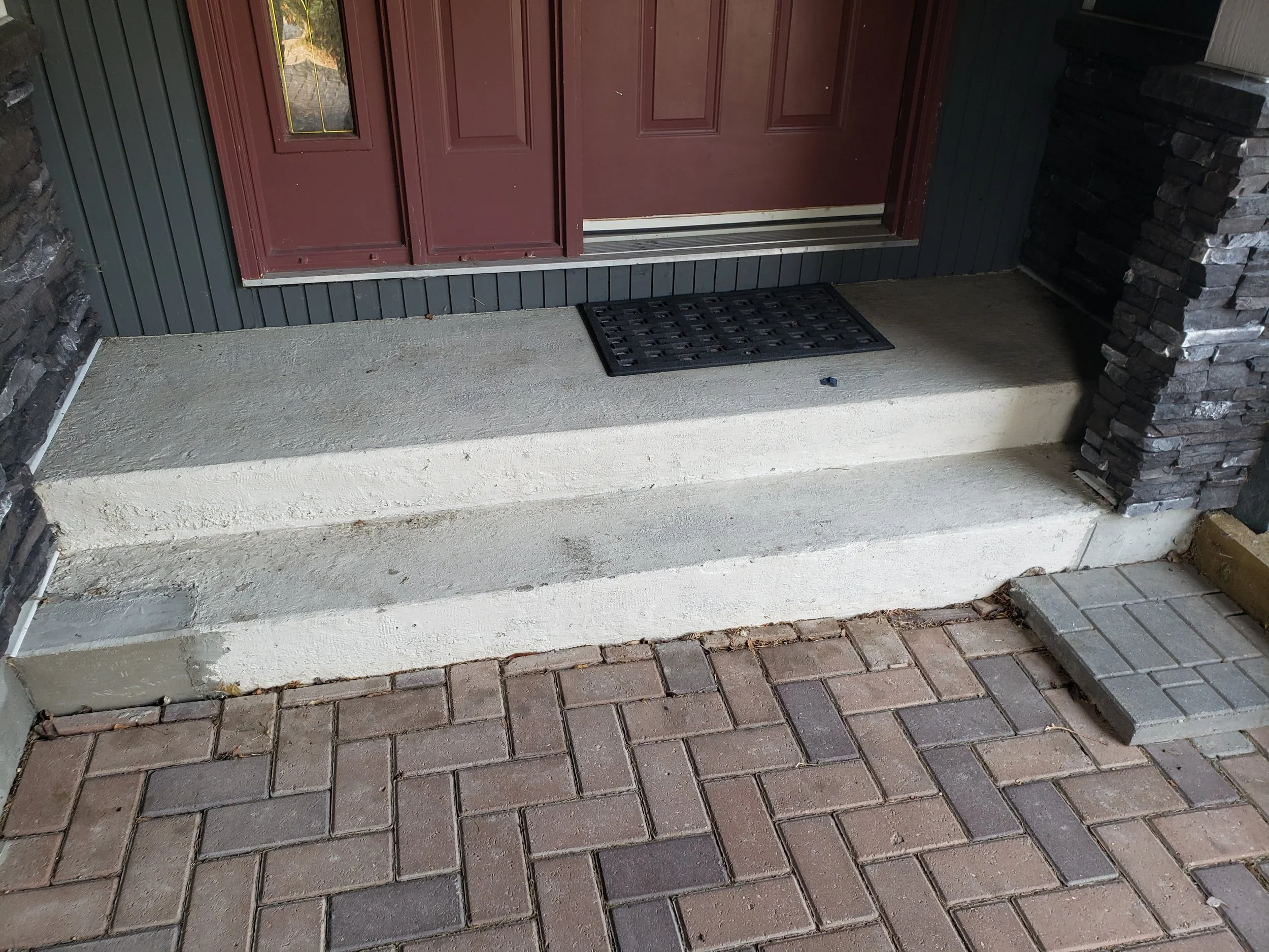 	
Concrete front step, grinded and repaired, ready for coating.