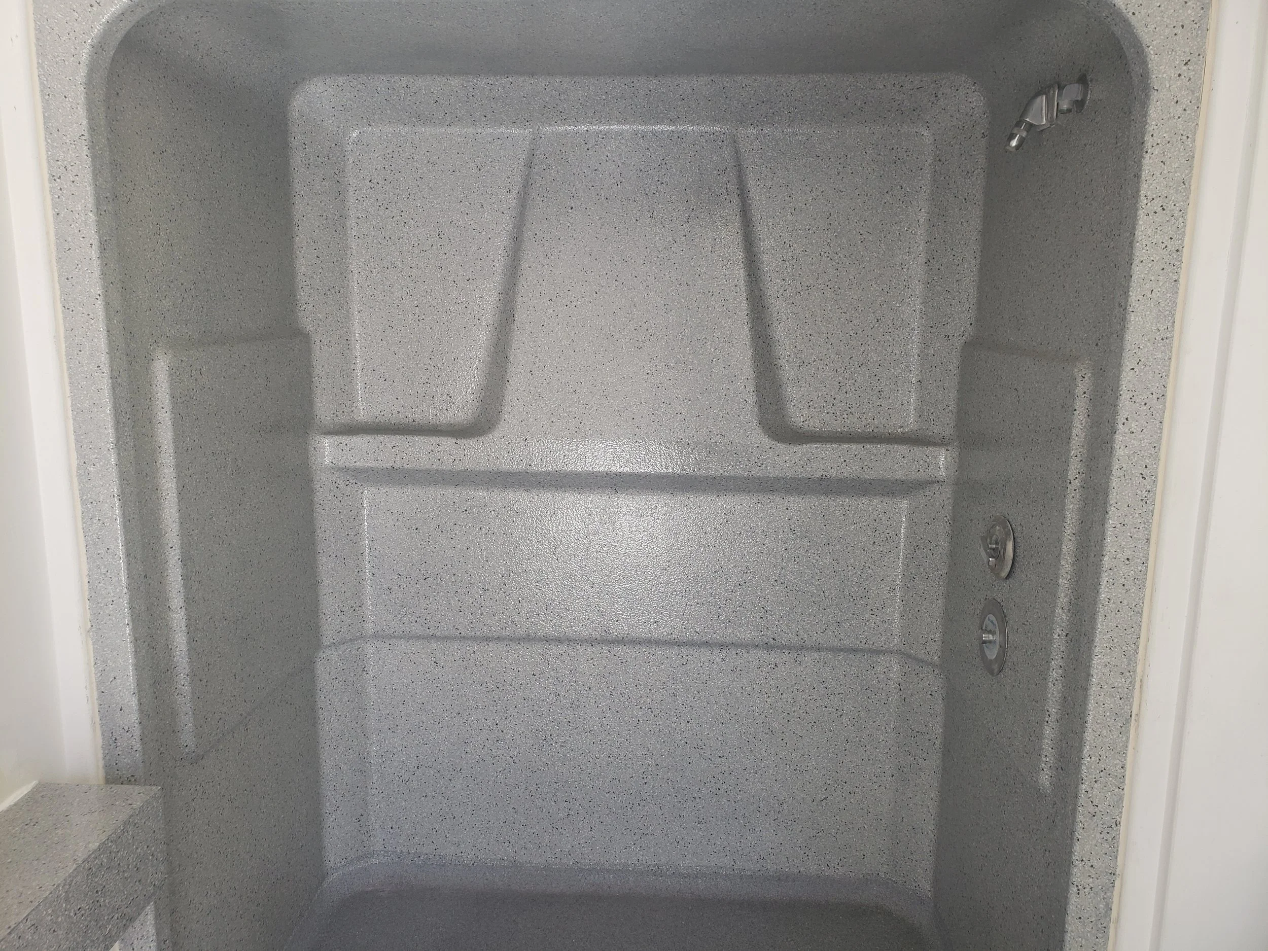 Shower coated in polyaspartic full flake broadcast. 