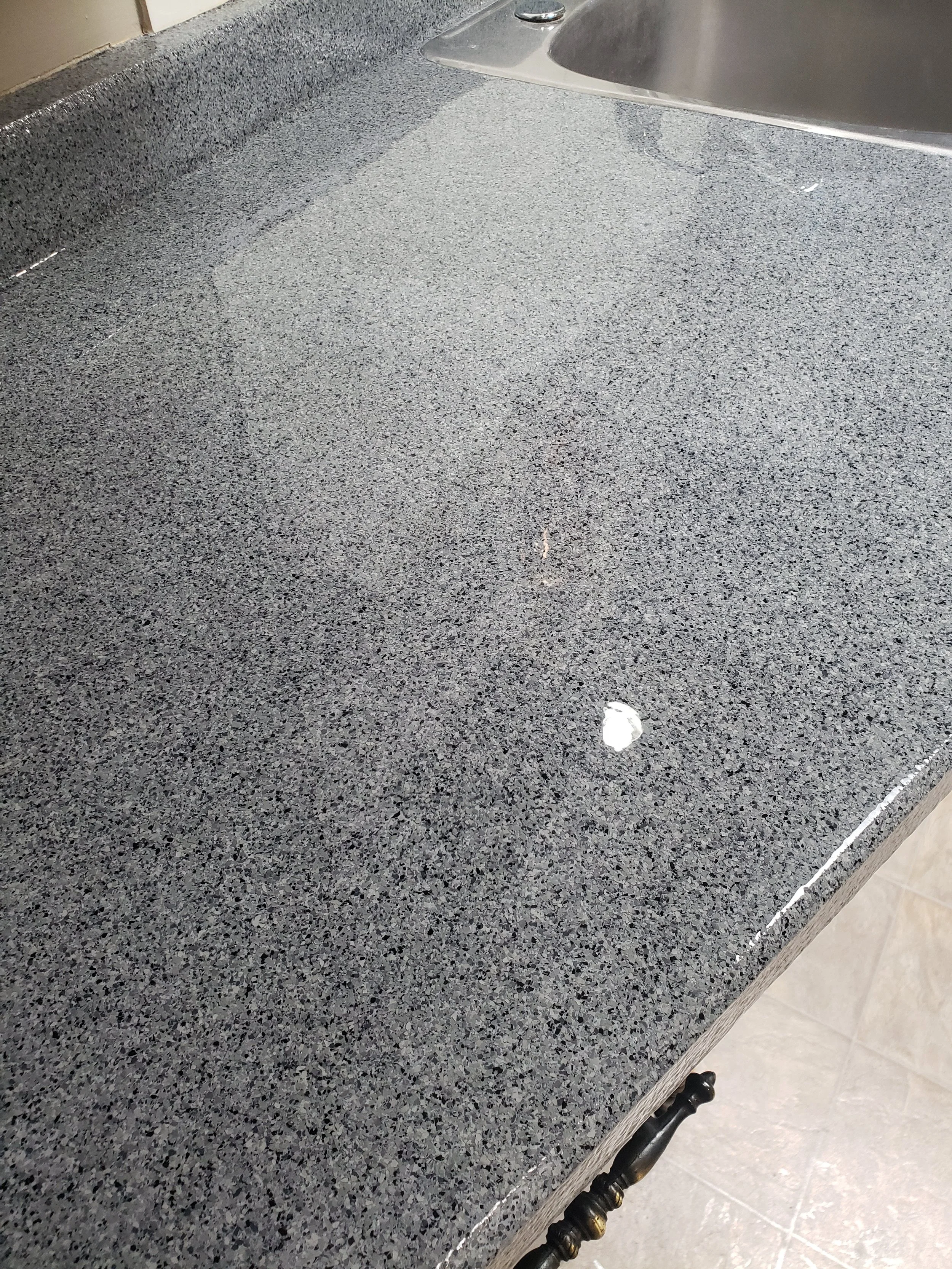 Polyaspartic Chip coated countertop.