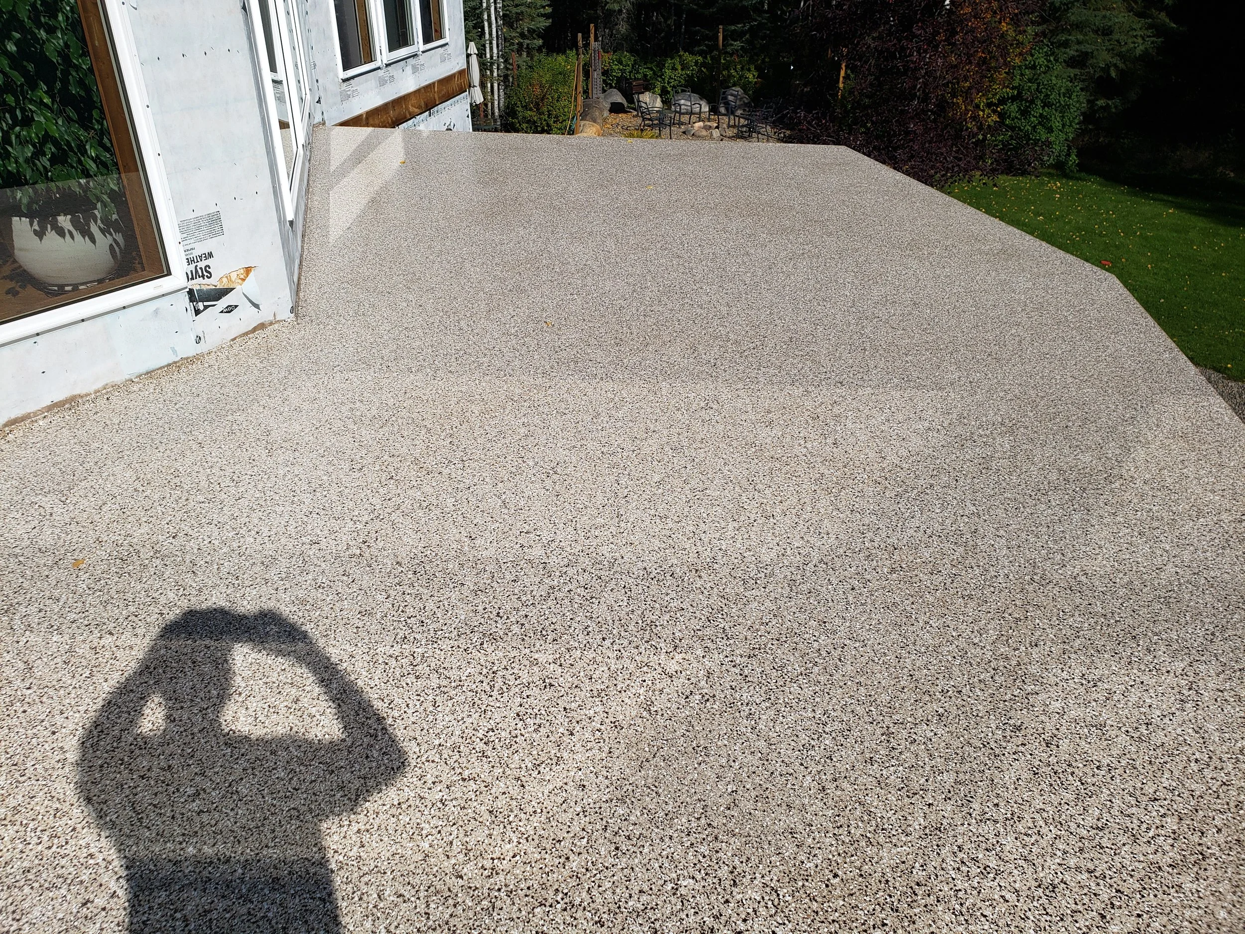 Balcony deck coated in polyaspartic quartz stone finish.