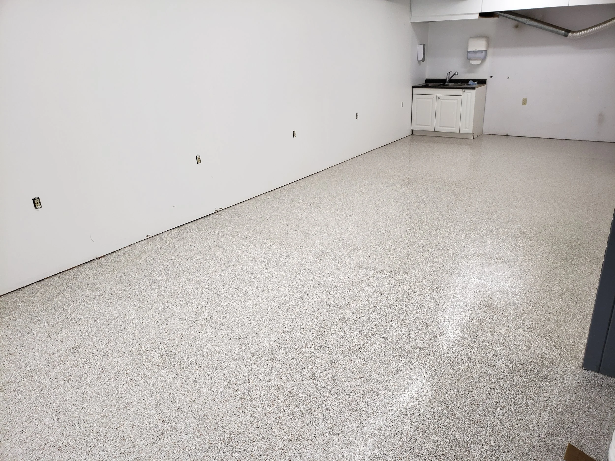 	
Convenience Store floor finished in polyaspartic full flake broadcast.