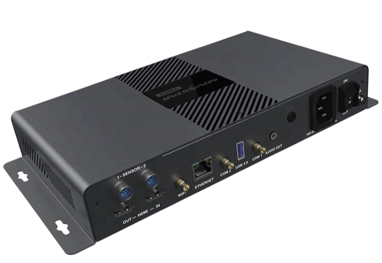 A black and gray electronic device with multiple ports including HDMI, Ethernet, USB, and audio output, likely a video or audio processing unit.