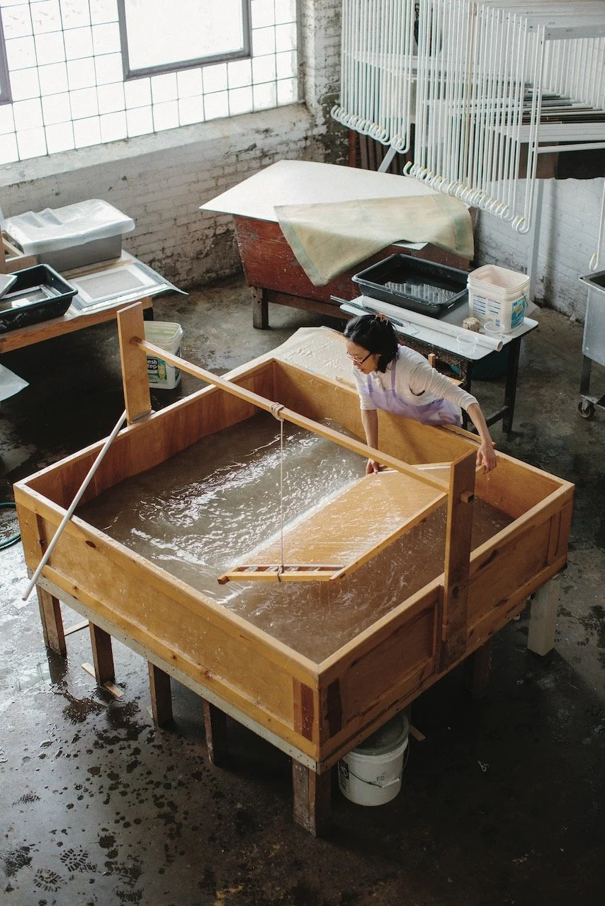 Traditional Korean artisan pulling Hanji paper sheets from a pulp vat. Source: Korea.net