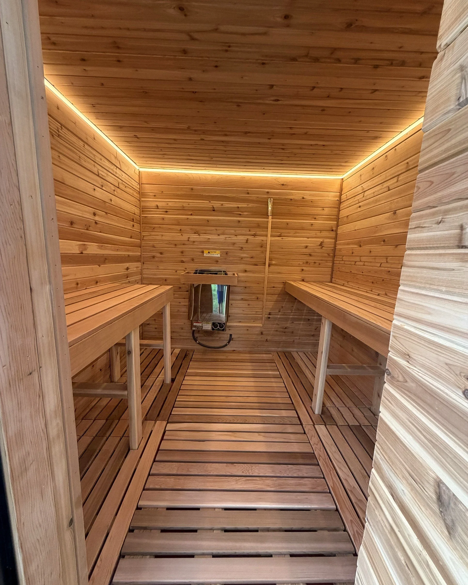 Cedar sauna interior inside the Suncoast Recovery mobile trailer, Tampa Bay FL
