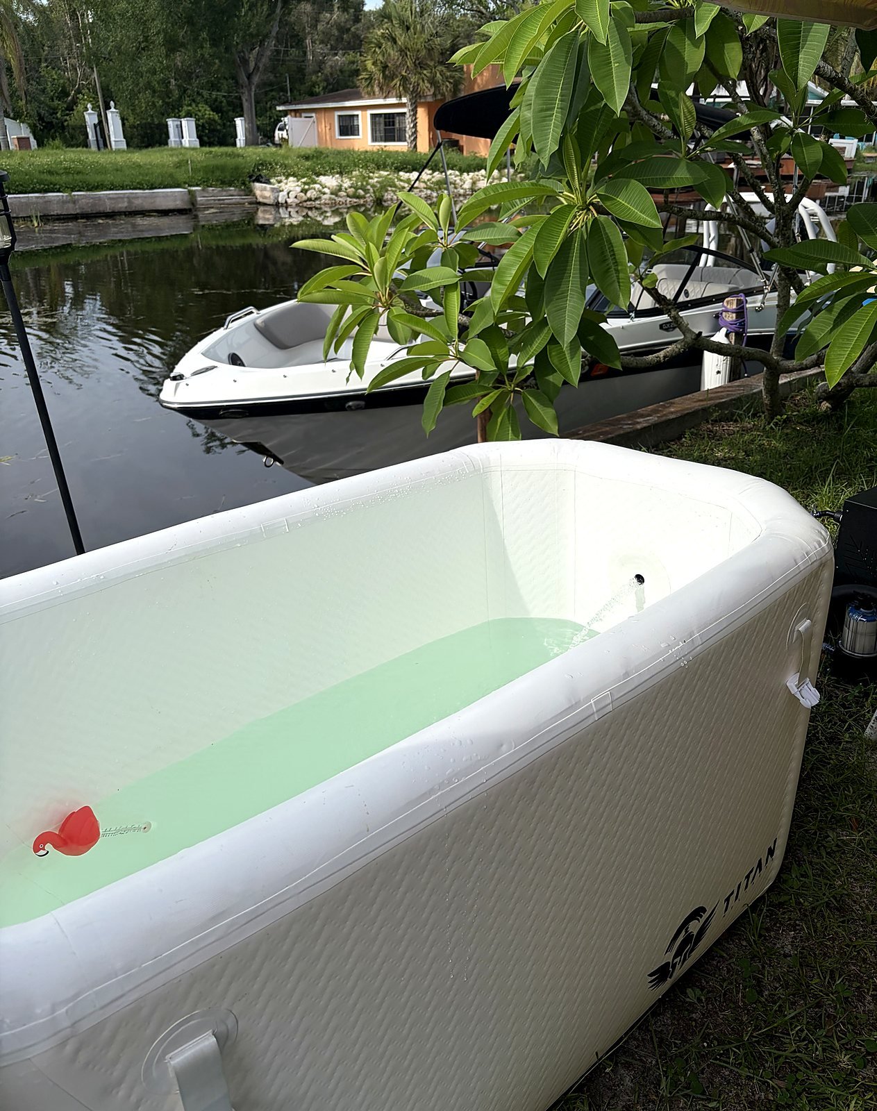 At-home cold plunge tub rental set up in a waterfront backyard in Tampa Bay FL