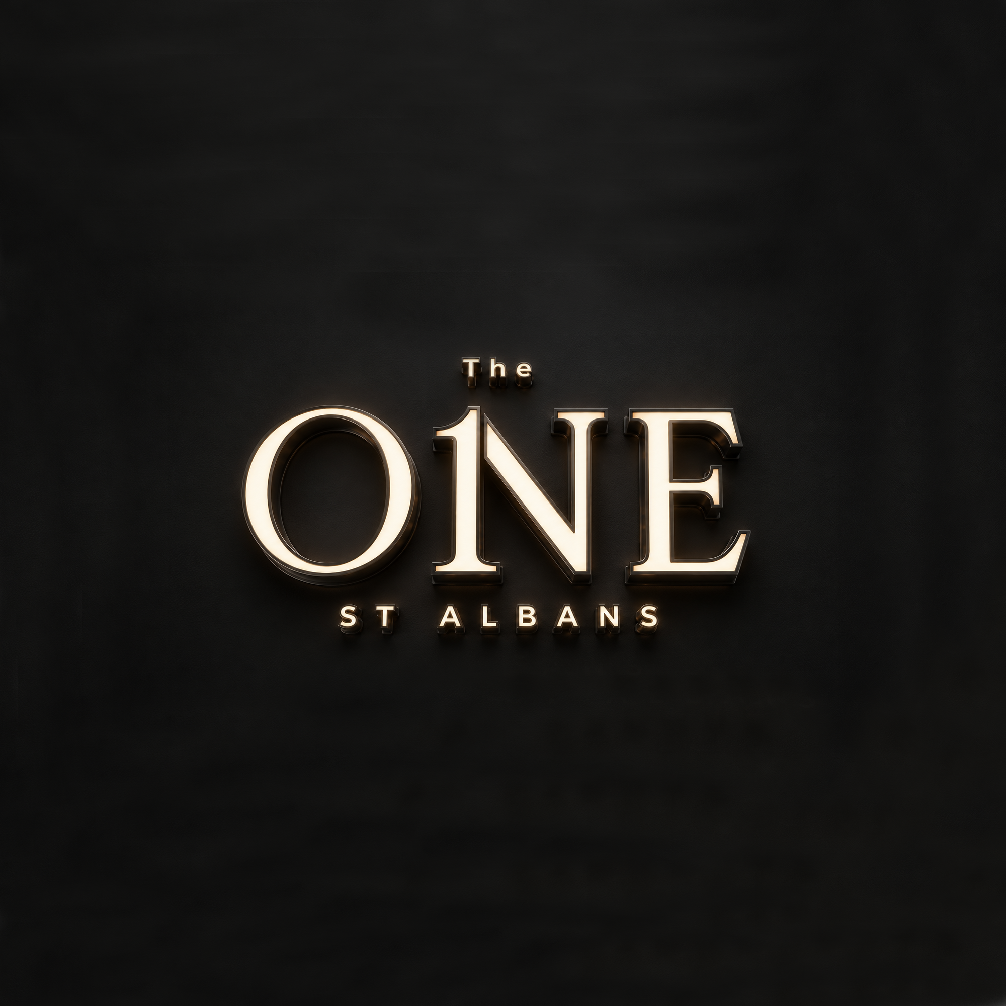 Close-up of a black wall with illuminated text reading 'The ONE STALBANS' in gold-colored letters.