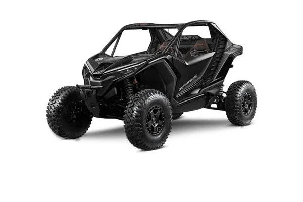 A black off-road side by side utv vehicle with large tires and an enclosed roll cage.