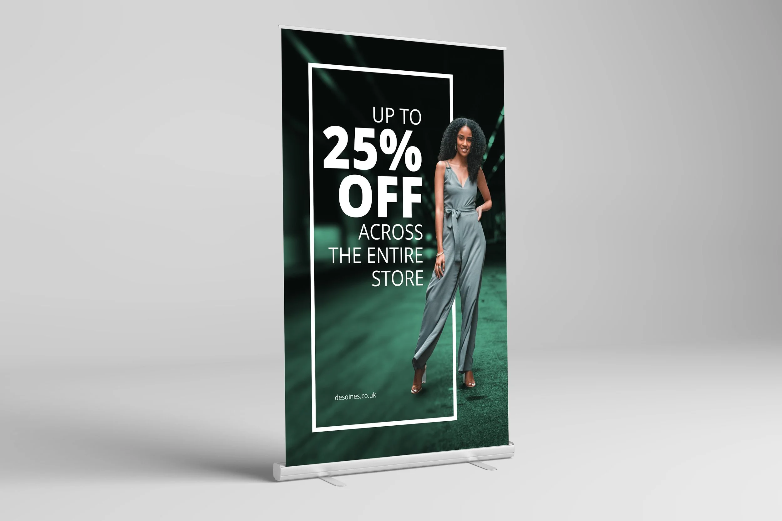 A vertical banner with a woman in a silver jumpsuit standing outdoors, text that says 'Up to 25% off across the entire store', and a website URL 'desoines.co.uk' at the bottom.