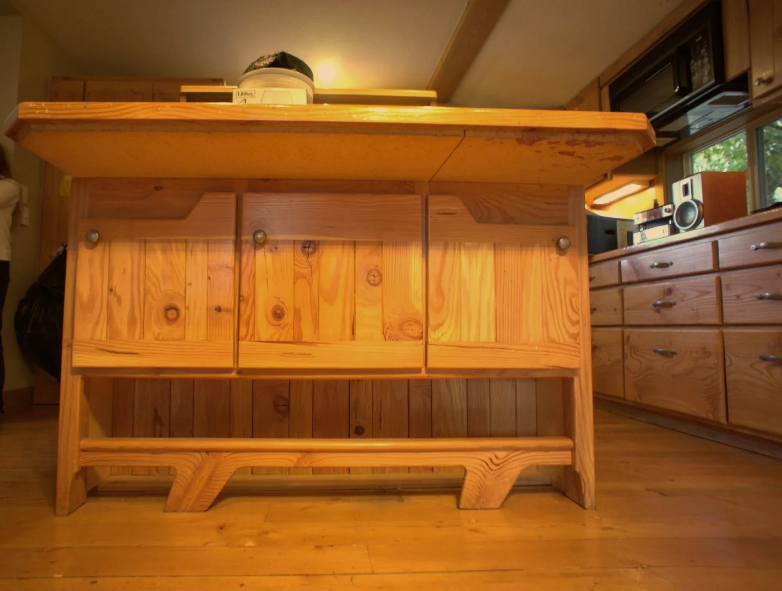 Foot rest and cabinets under island counter