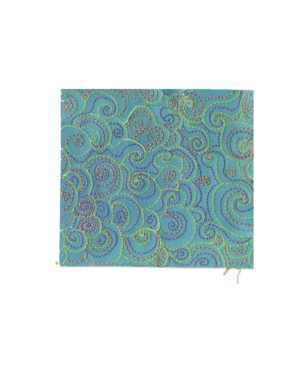 A square piece of paper with swirling, colorful embroidery in green, purple, and bronze thread on a turquoise background.