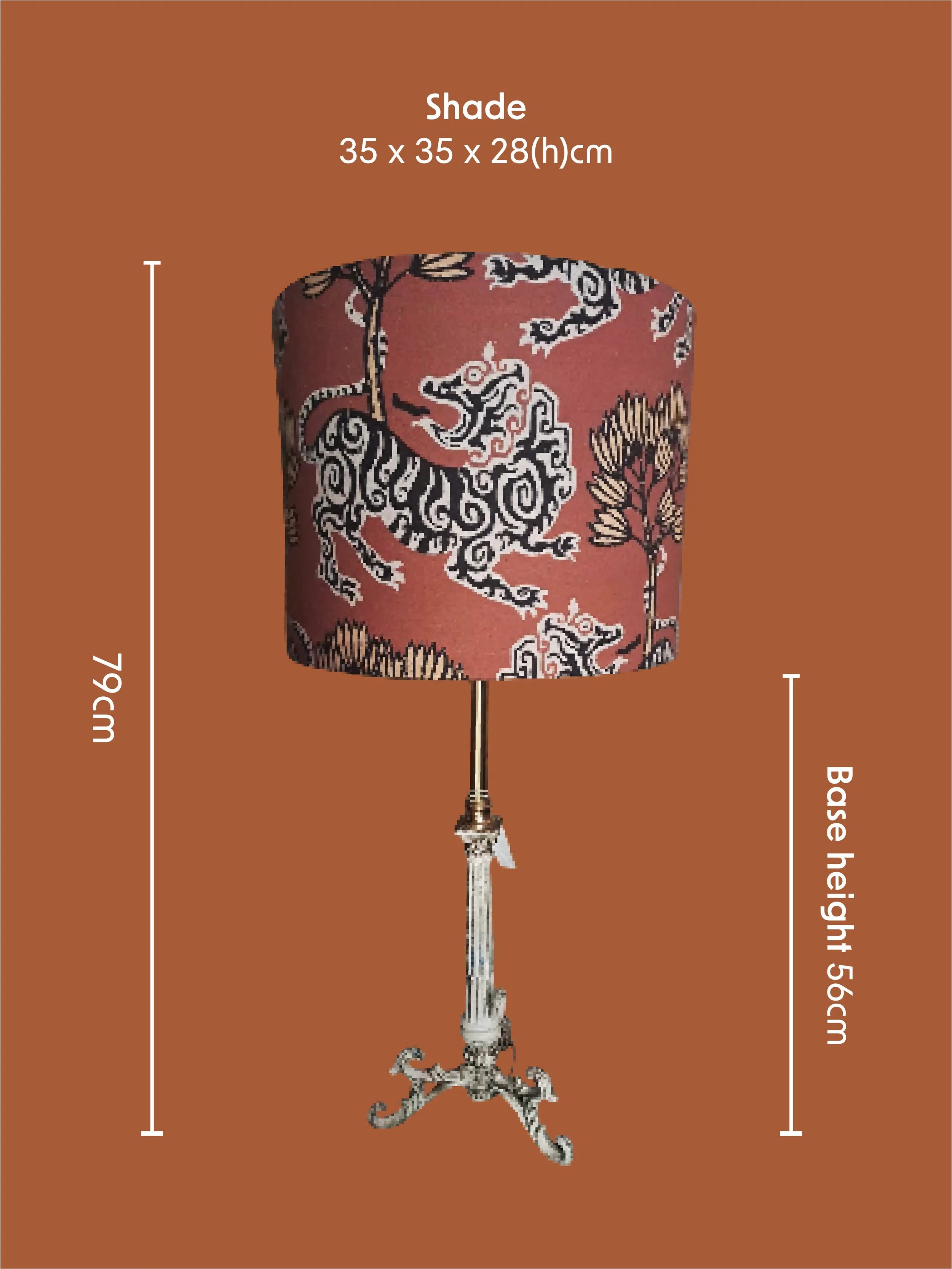 A decorative table lamp with a patterned shade featuring black, white, and brown dragon designs, a ornate metal base, and a tassel hanging from the bottom of the shade. I designed a variety of colourful background lampshade social media posts.