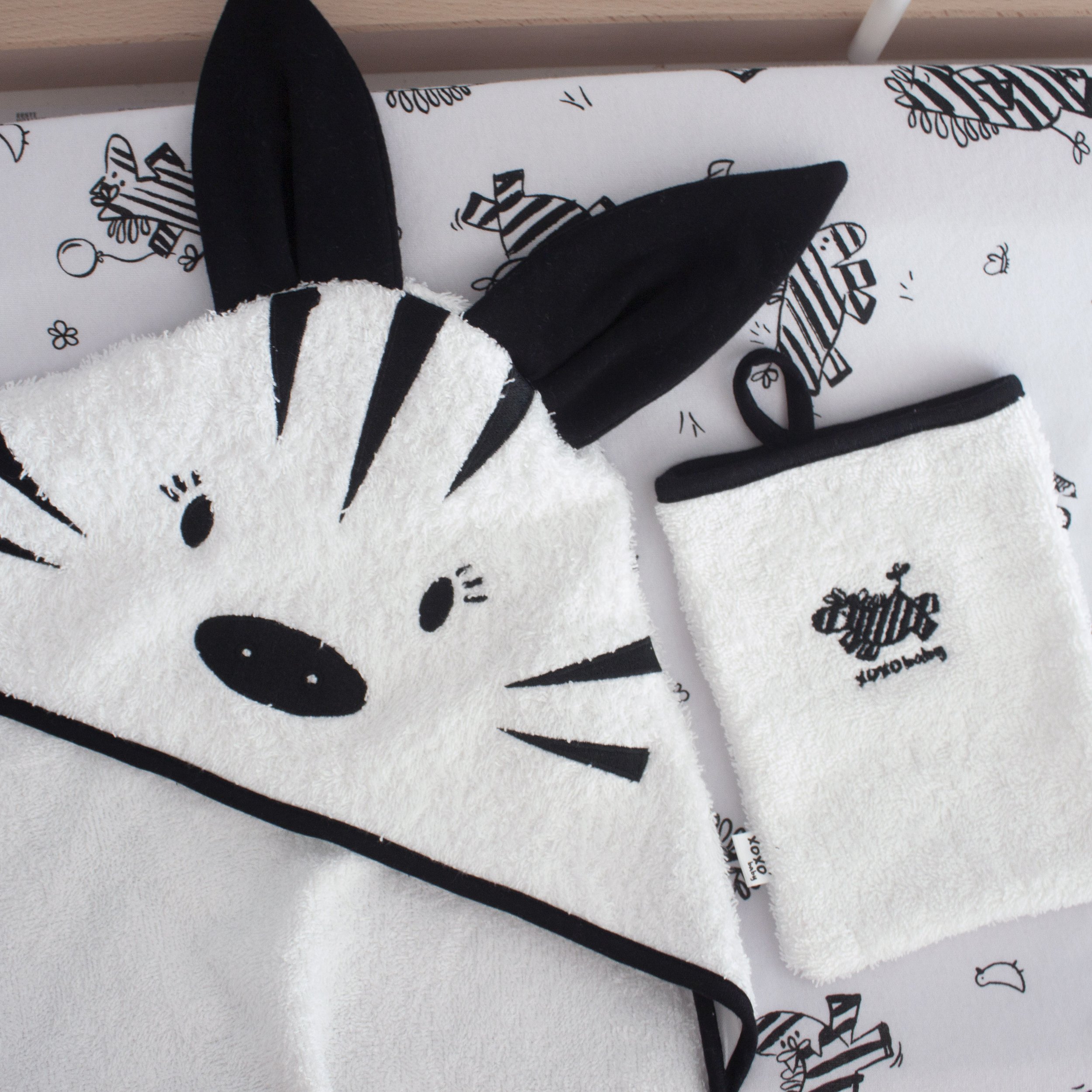 a baby hooded towel zebra design with a matching face cloth