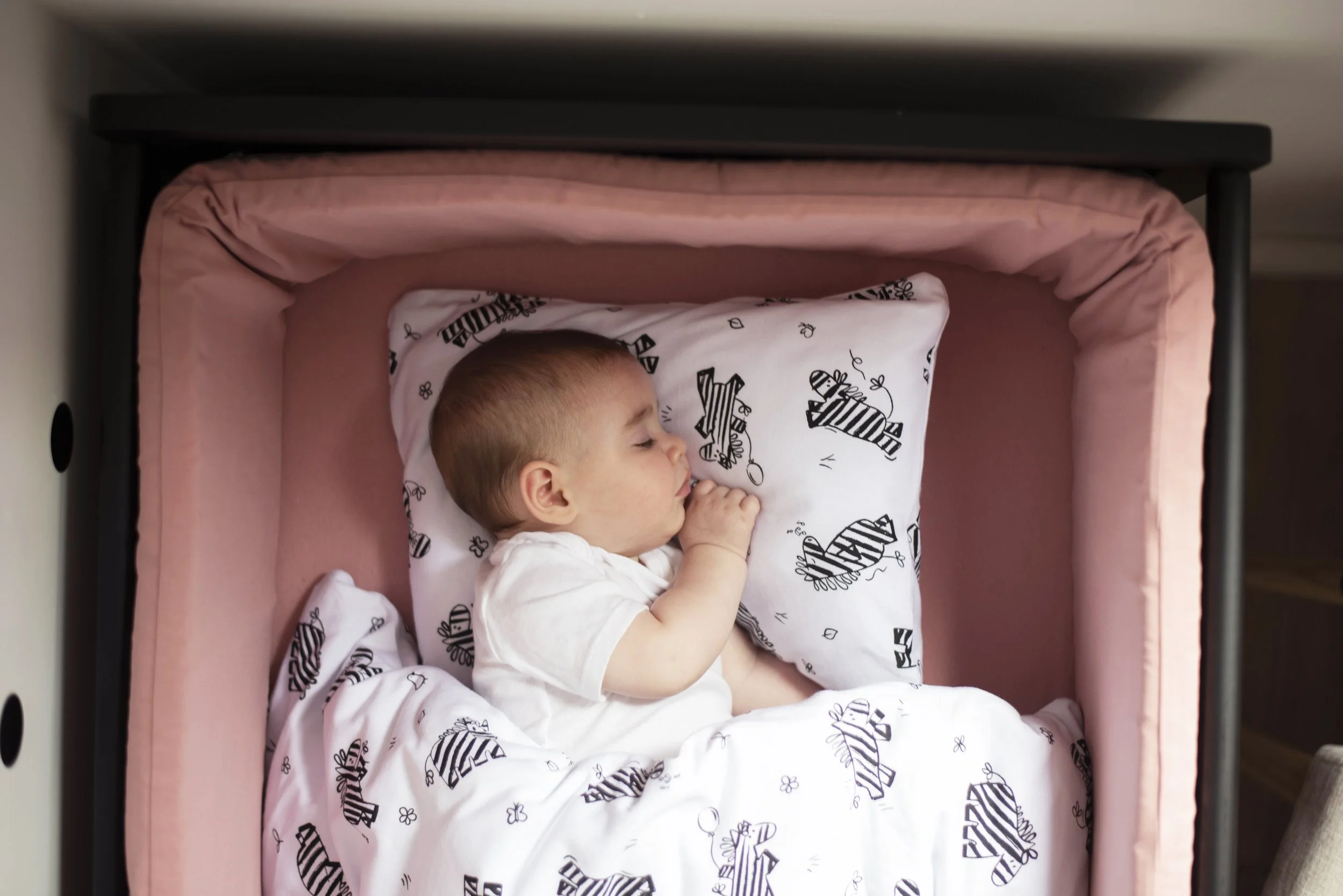 Zebra themed textile design on cot nursery linen
