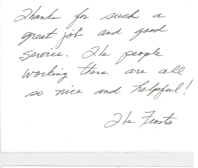 Close-up of handwritten note expressing gratitude and praise for good service and helpful staff.