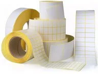 Assorted blank label rolls and label stock in different sizes and formats.