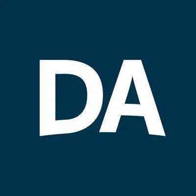 Dave and Adam's Card World Logo White letters "DA" on a dark blue background.