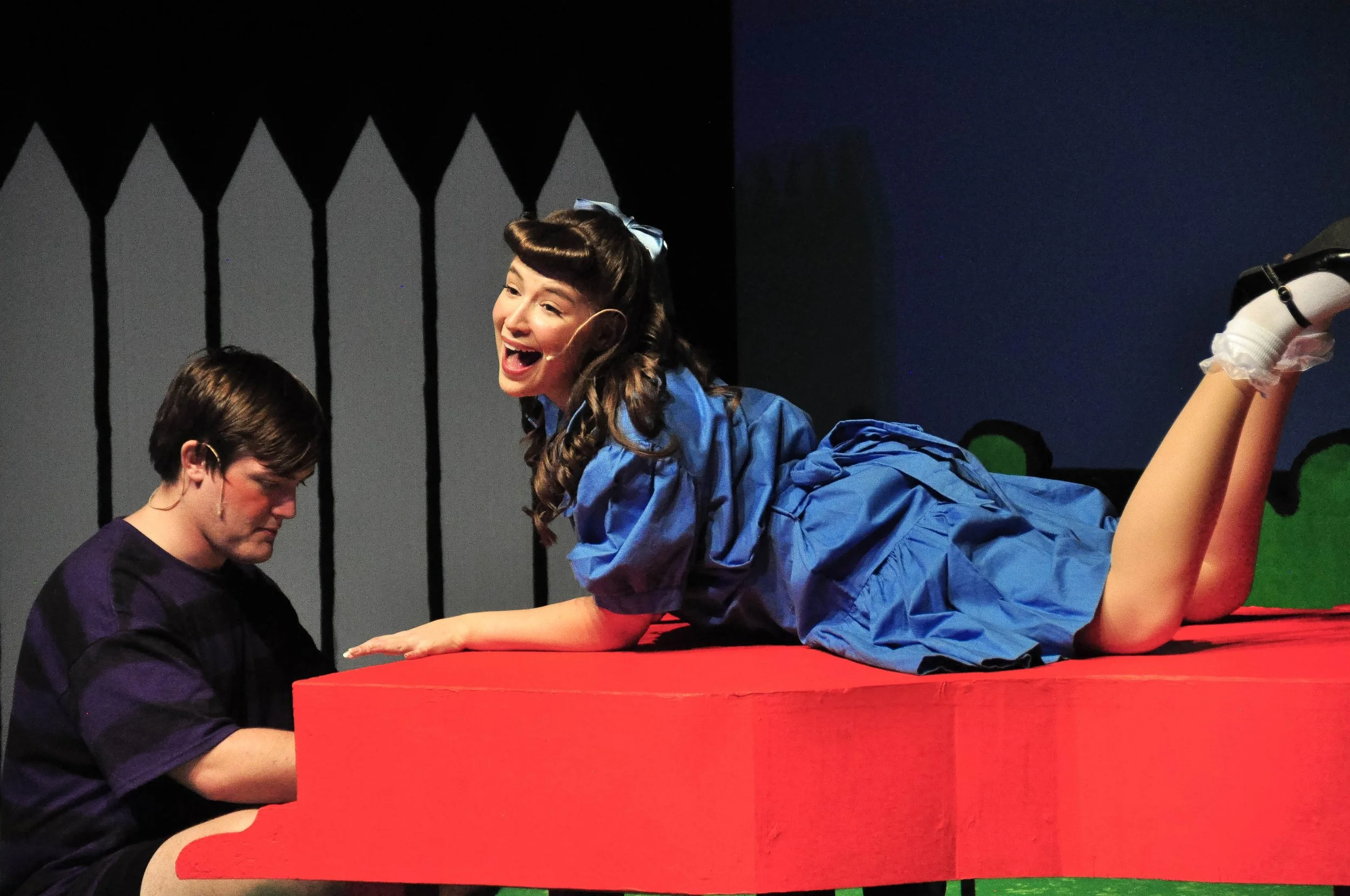 A woman playing Lucy Van Pelt in a musical of You're a Good Man Charliee Brown
