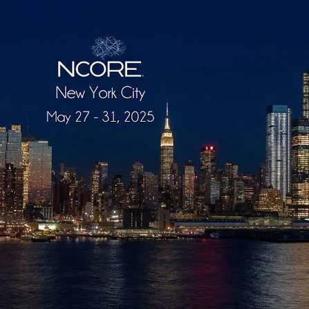 Nighttime city skyline of New York City with the Empire State Building illuminated. Text overlay reads 'NCORE New York City May 27-31, 2025'.