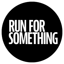 A black circle with white text that says 'RUN FOR SOMETHING'.