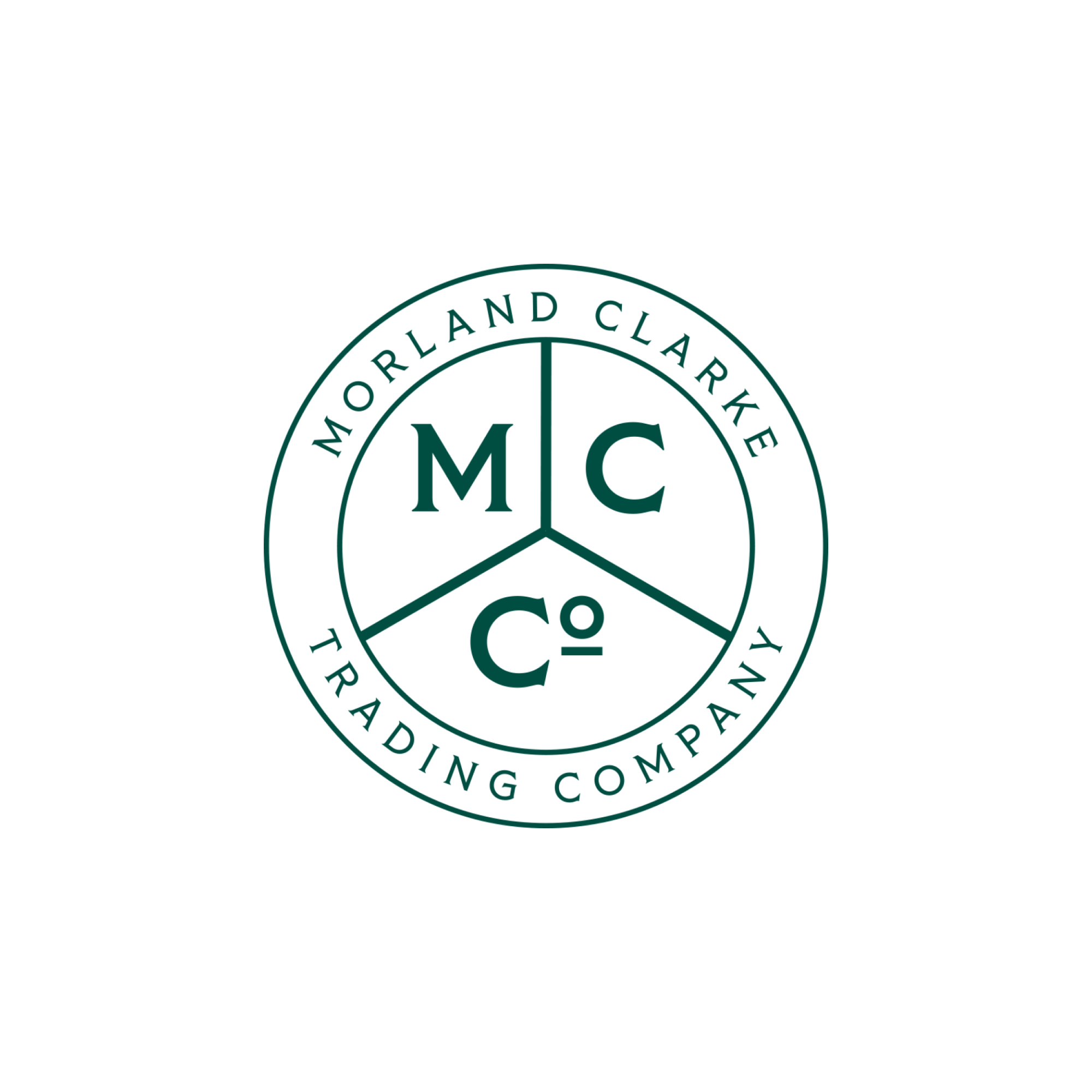 Close-up of a circular logo that reads 'MORRLAND CLARKE TRADING COMPANY' with the initials 'M C' in the center.