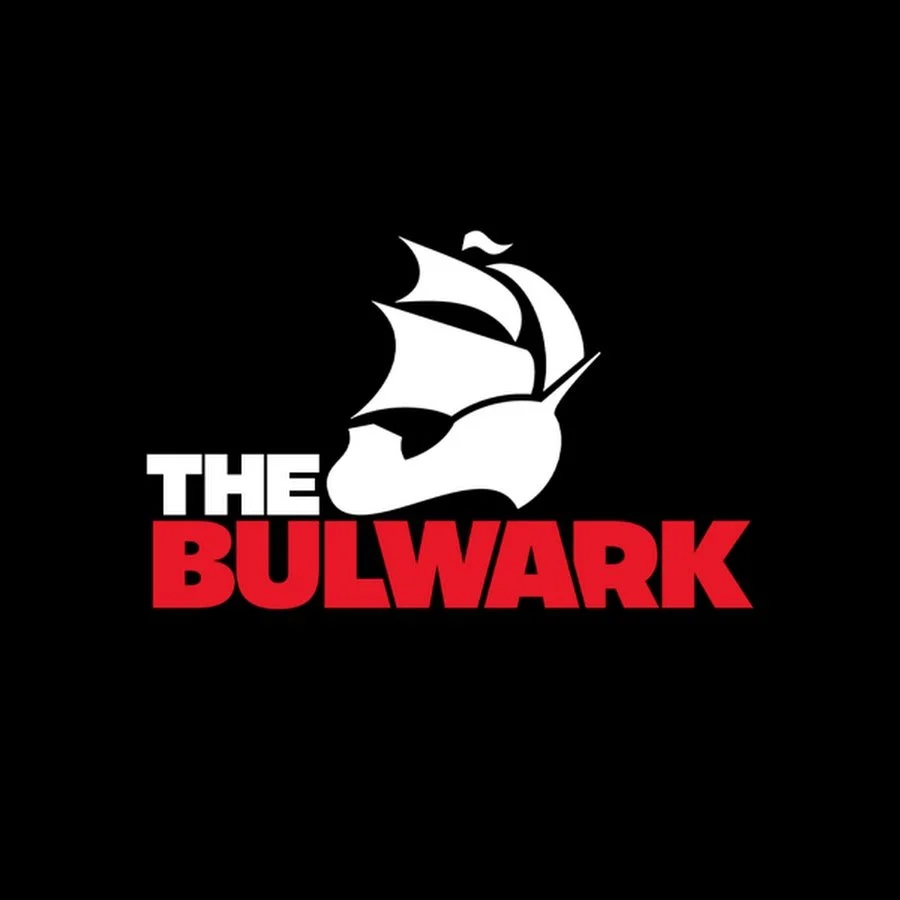 A logo with a stylized pirate ship sail and the text "THE BULWARK" with "BULWARK" in red and "THE" in white on a black background.
