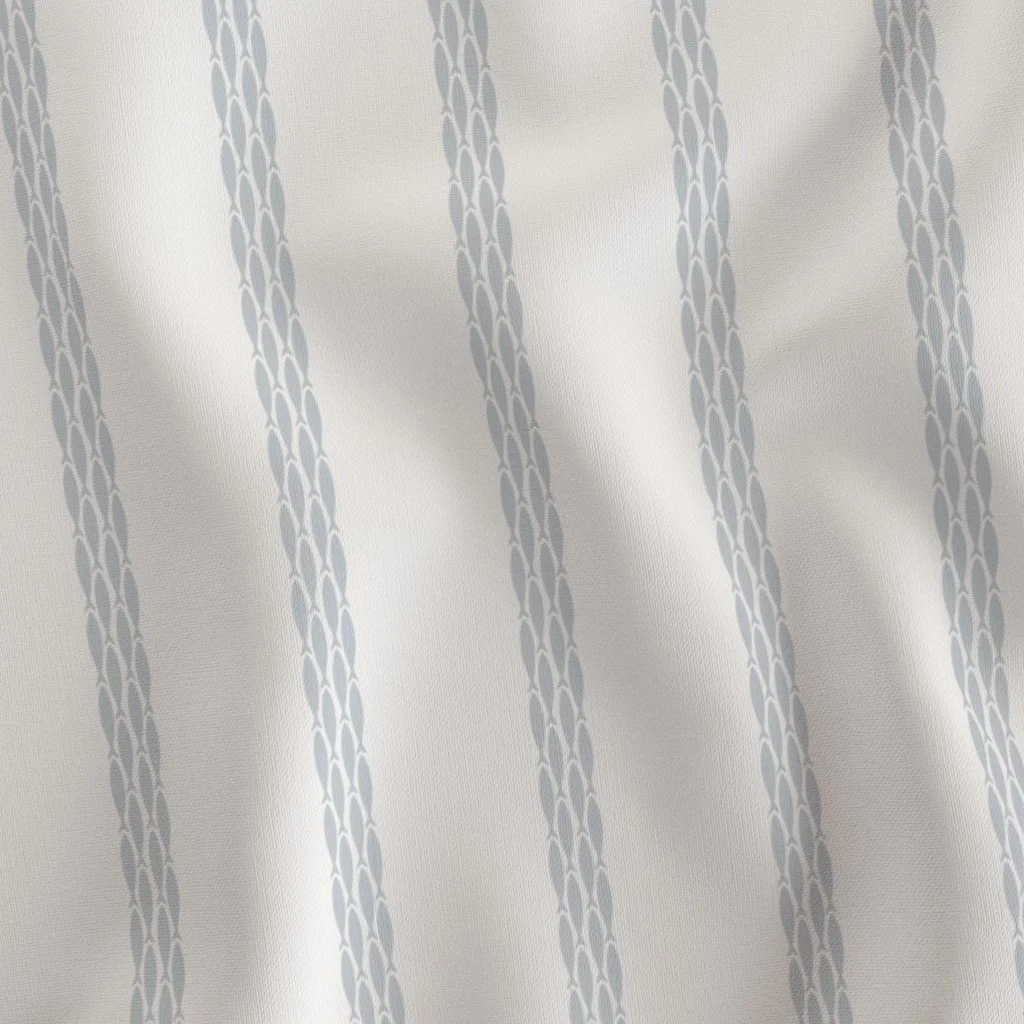 Close-up of a fabric curtain with vertical gray and white stripe pattern.