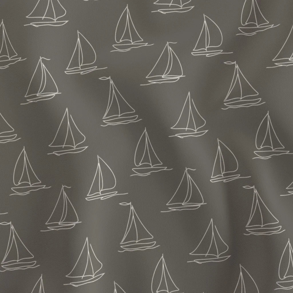 Gray fabric with a repeating pattern of white line drawings of sailboats.