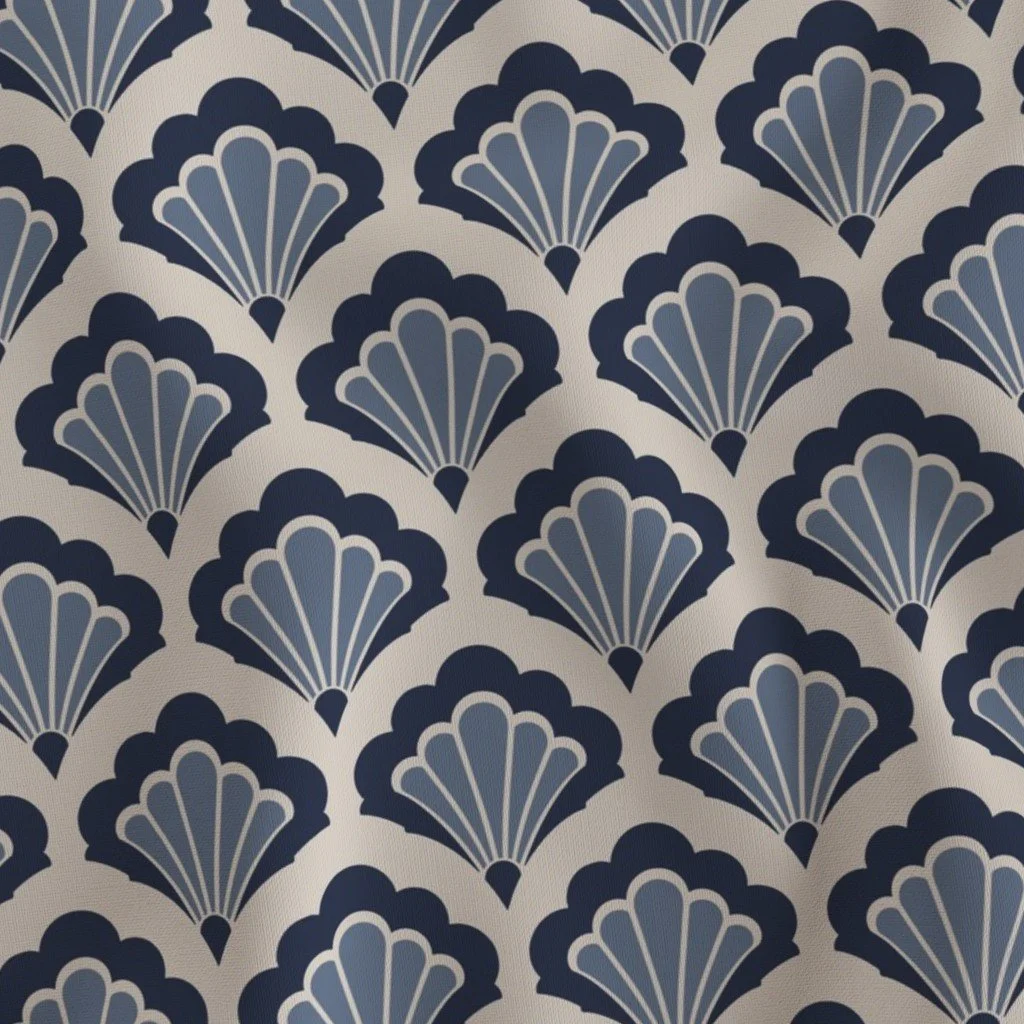 A pattern of navy blue and light blue fan-shaped designs on a light beige background.