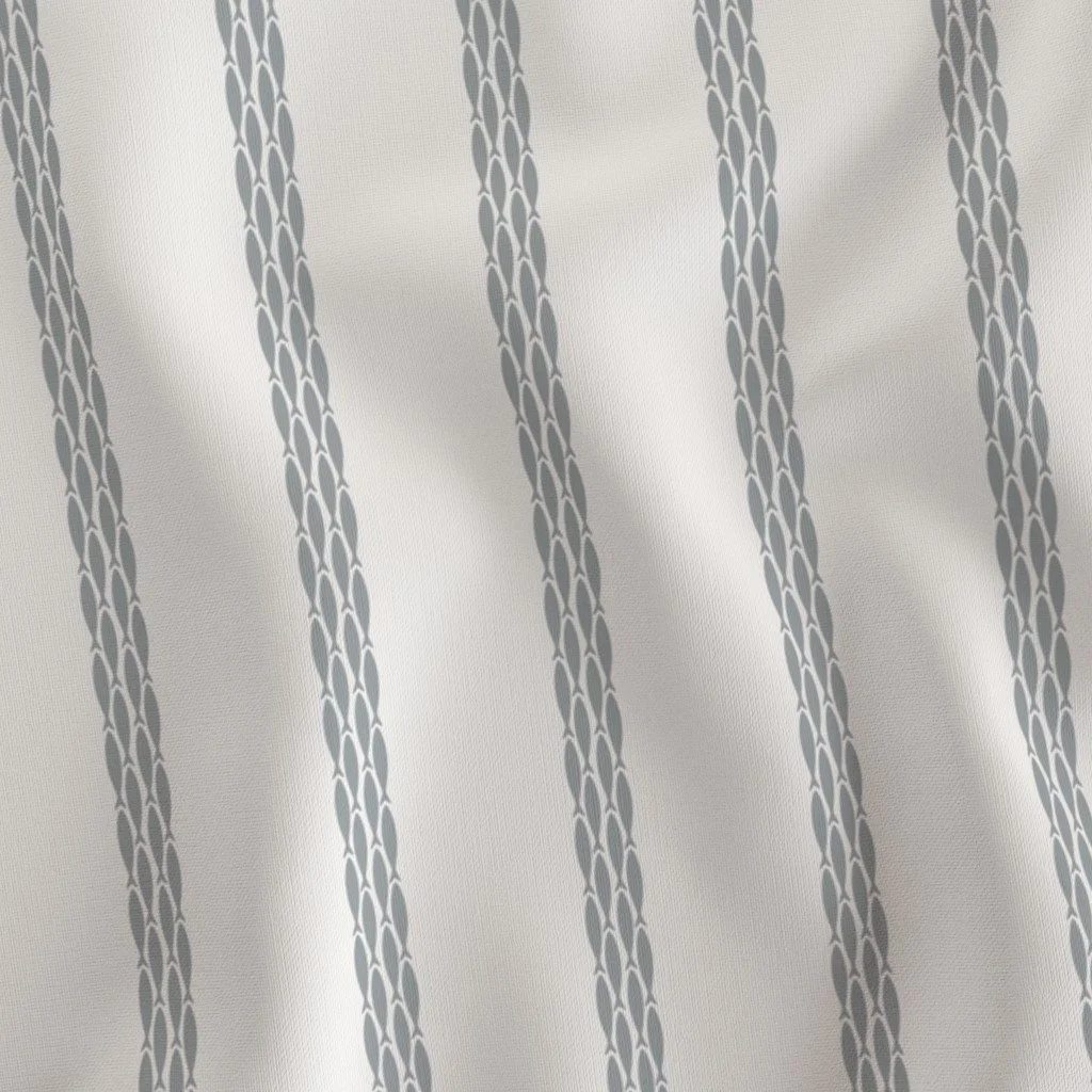 Close-up view of a light-colored fabric curtain with vertical gray stripe patterns.